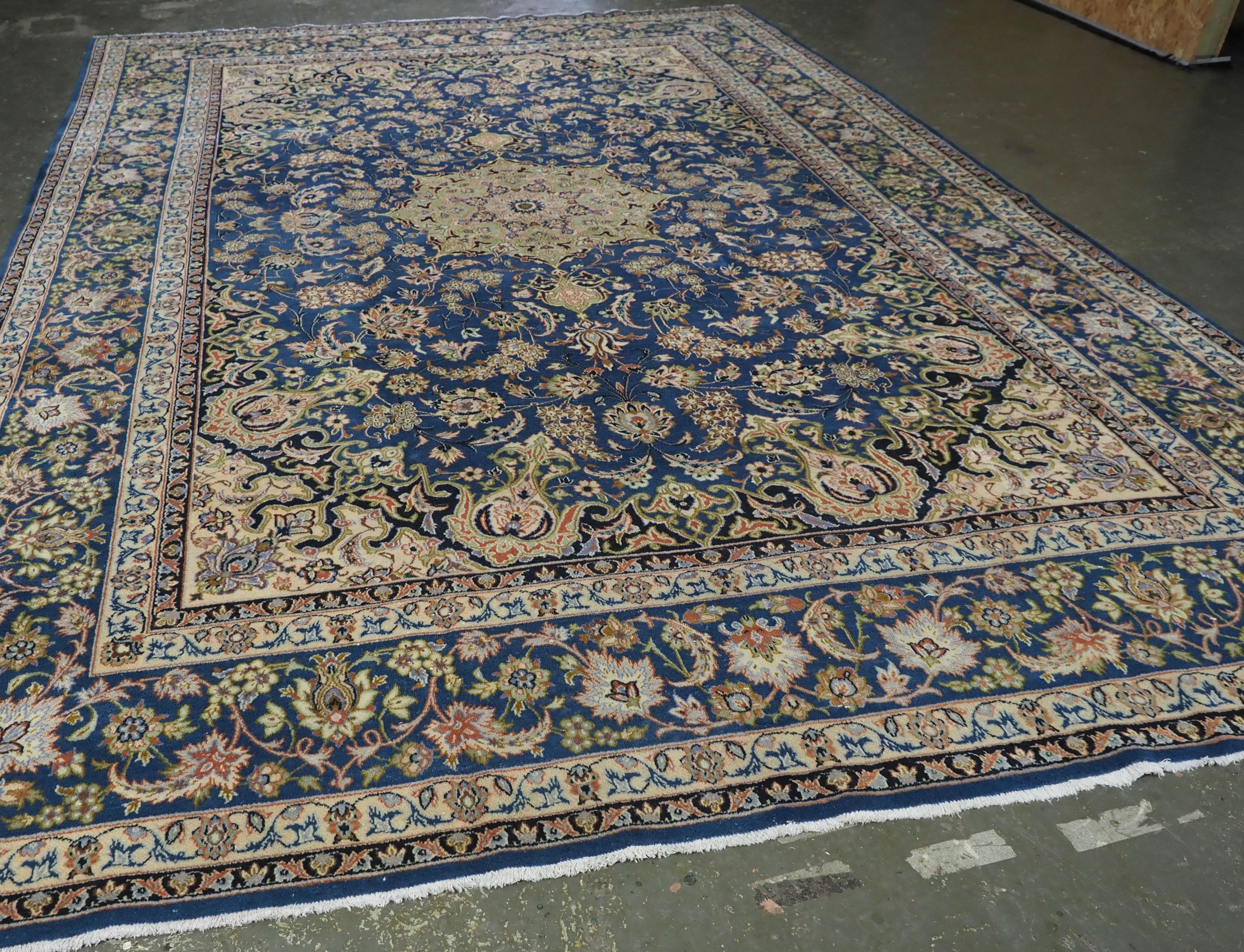 
Size: 16ft 3in x 10ft 10in (495 x 330cm).

Vintage Persian Kashan carpet of traditional small medallion design in a large room size.

Circa 1930.

A very good furnishing Kashan carpet with a traditional small medallion design. The carpet has a