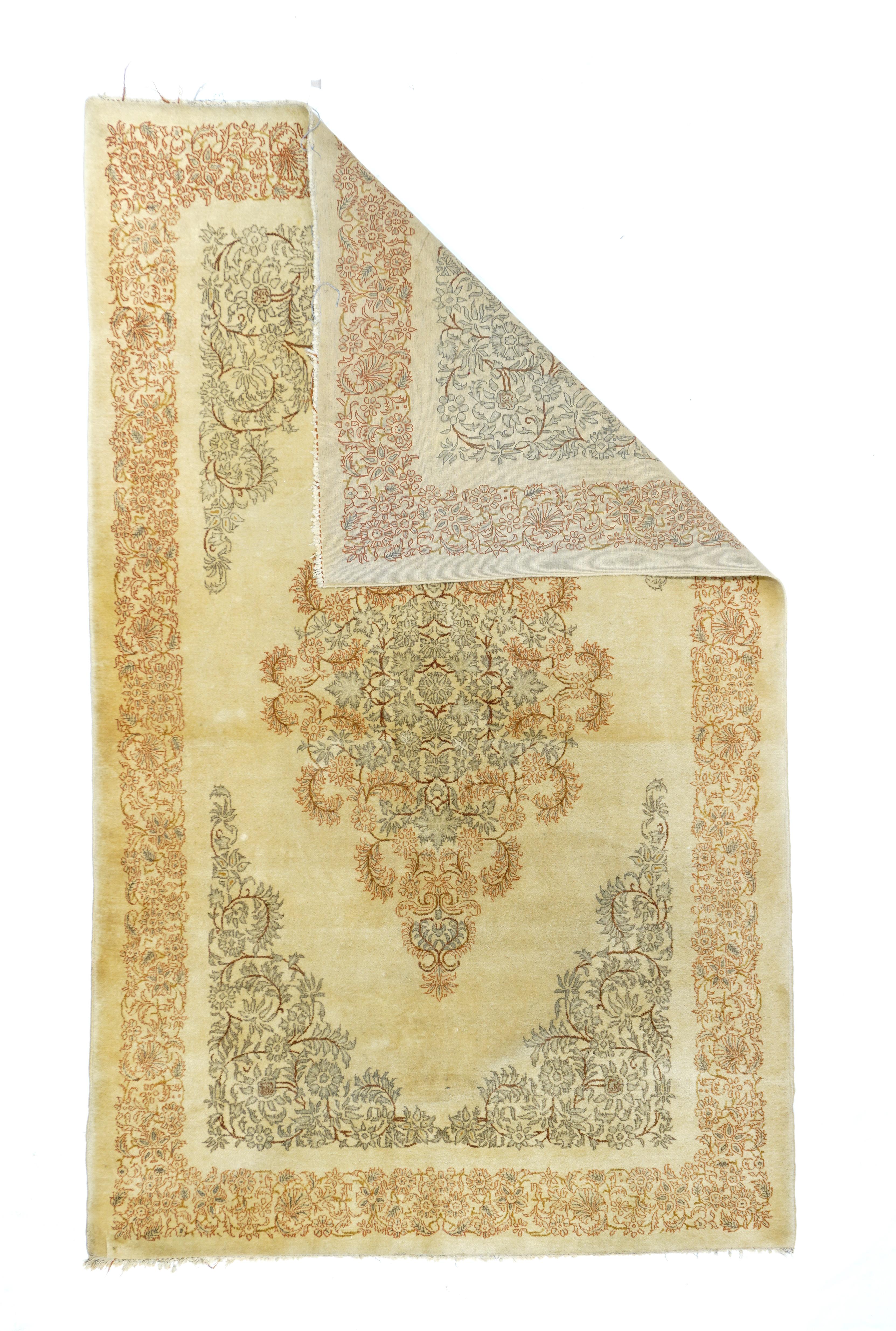 Vintage Kashan Rug 4'3'' x 7'3''. This vintage, well-woven city scatter shows a soft, 196=50's Kerman-style palette with an open straw-sand field dominated by a tall lozenge medallion partially defined by barbed, curved leaves. En suite corners.