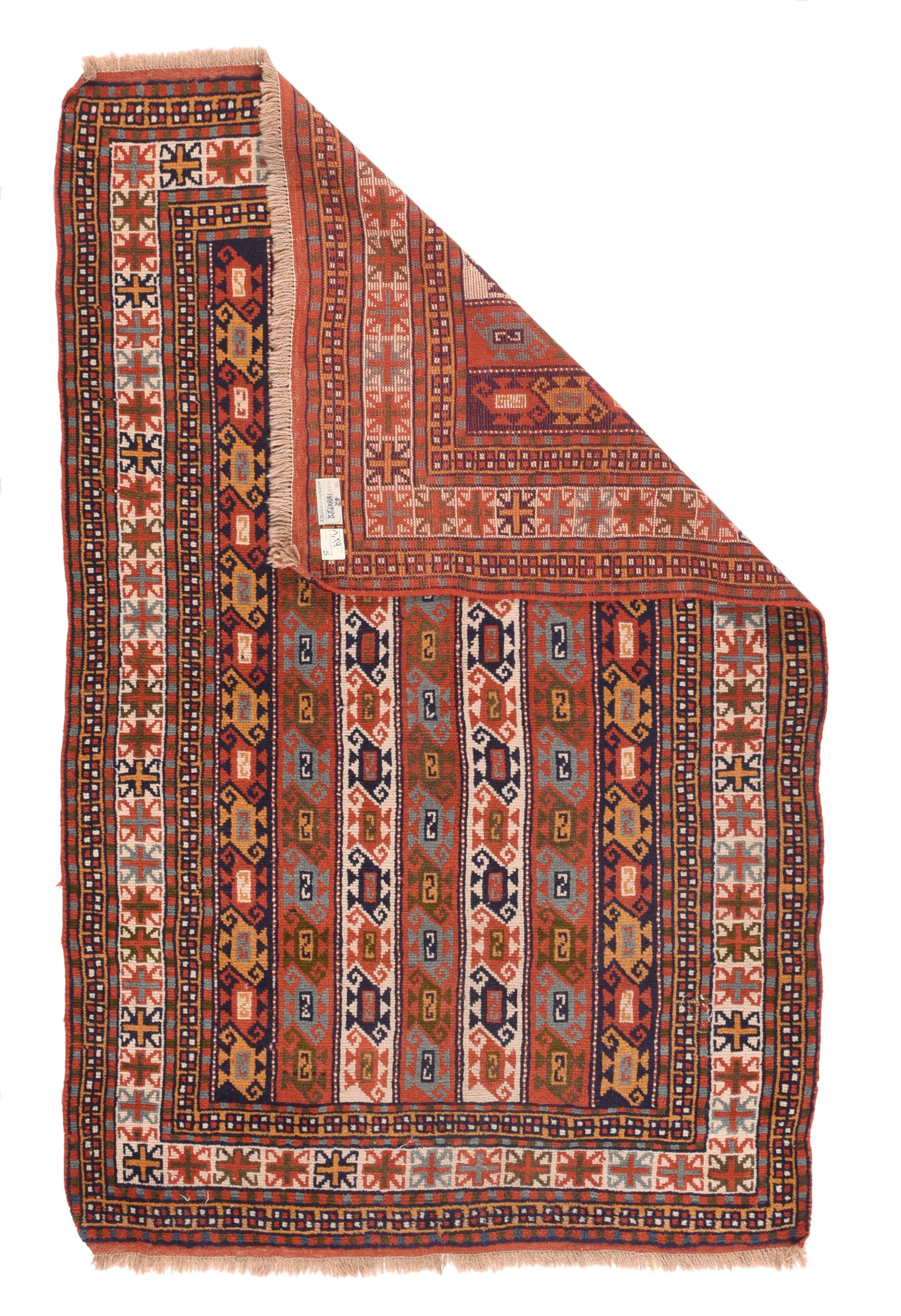Vintage Kazak Rug 4' x 6'3''. Not a Kazak, but from the Kurds in NE Persia, with their totally characteristic border system, and with a vertical stripe design in rust-red, navy and cream featuring S-shaped double end botehs. Narrow flat woven end