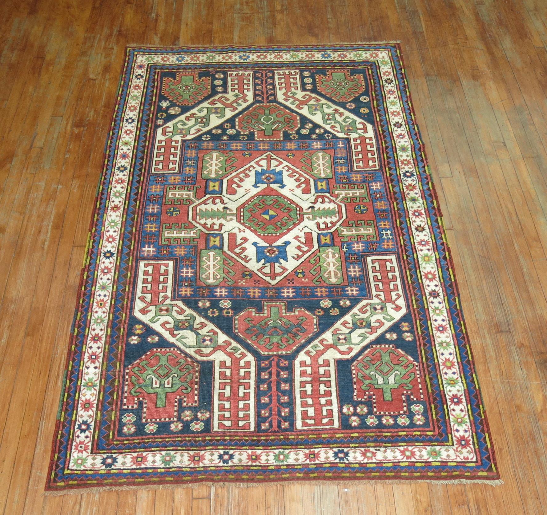 An authentic decorative vintage Kazak Kasim rug.

4'10