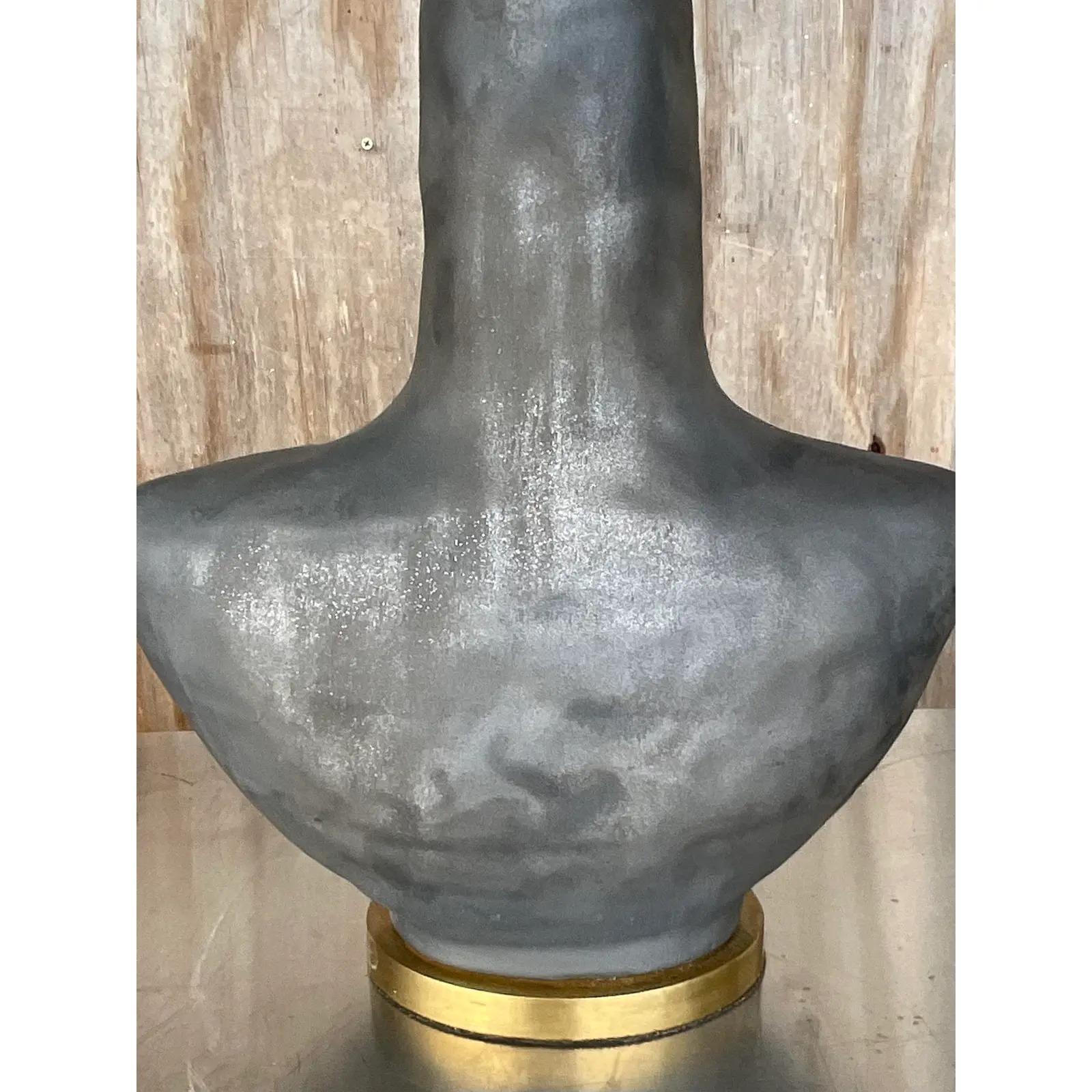 Incredible pair of vintage table lamps. Made by the iconic Kelly Wearstler for Visual Comfort. The beautiful Armato design with a torched finish and brushed brass hardware. Marked on the plinth and the socket. Acquired from a Palm Beach estate.