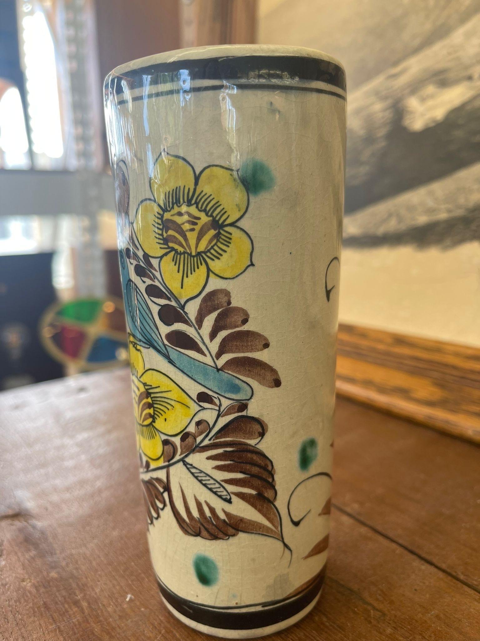 Antique Style Vase with Blue , Yellow Bird and Flower Motif. Opposite Side of the Vase Has a Leaf as Pictured. Wear and Tear Consistent with Age.

Dimensions. 3 W ; 3 D ; 7 H