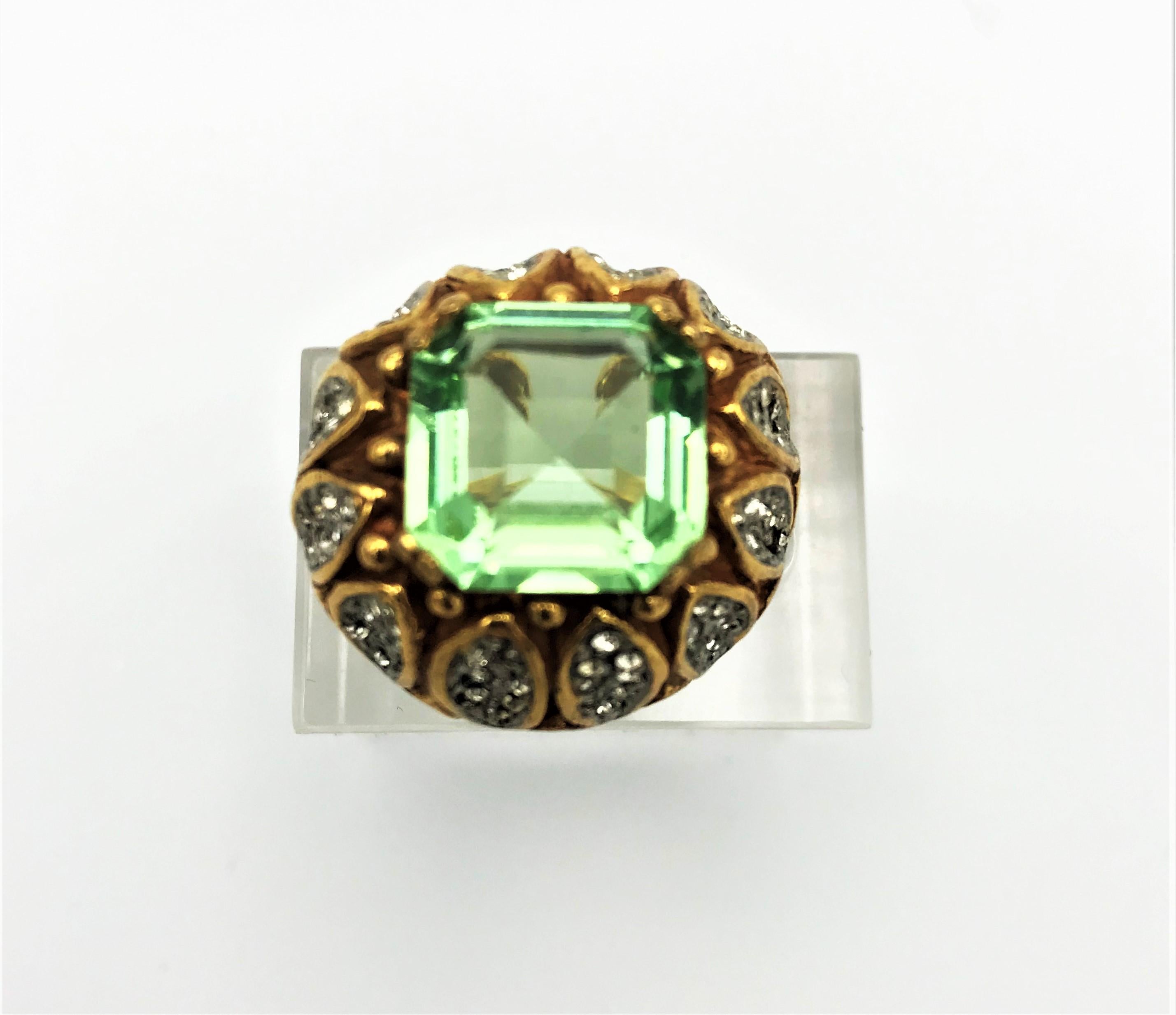 An elegant and very rare Cocktail ring designed by Kennet Jay Lane in the 1970s.  
 It's lucky to find a ring like this! A lot of brooches and chains were made during this period, but hardly any rings! It is beautifully worked with the large emerald