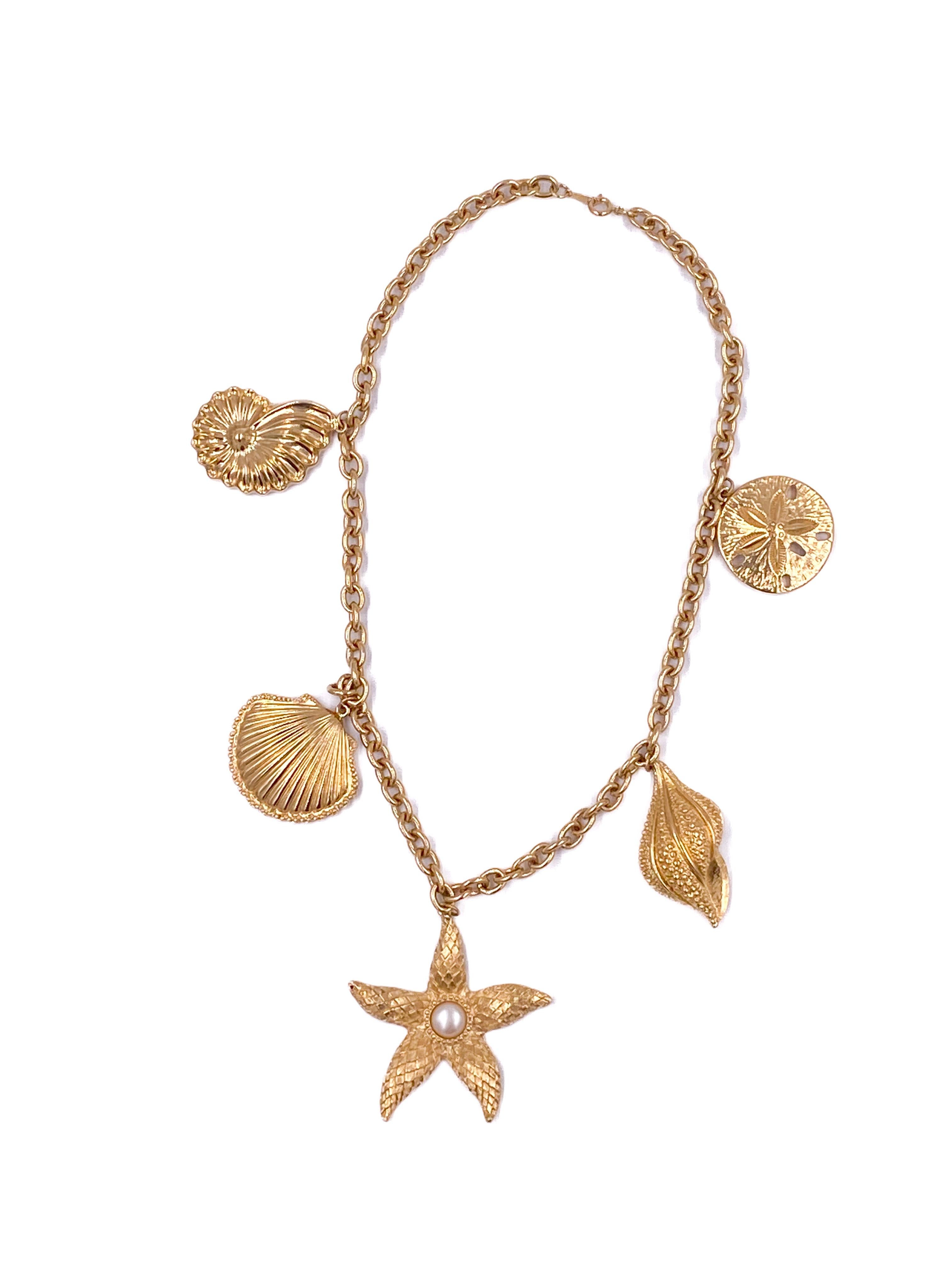 Capture the essence of summer with the vintage Kenneth Jay Lane for Avon Gold Shell Starfish Necklace. Featuring textured gold-colored seashells and starfish accented with delicate pearl details, this piece evokes coastal elegance. Perfect for beach