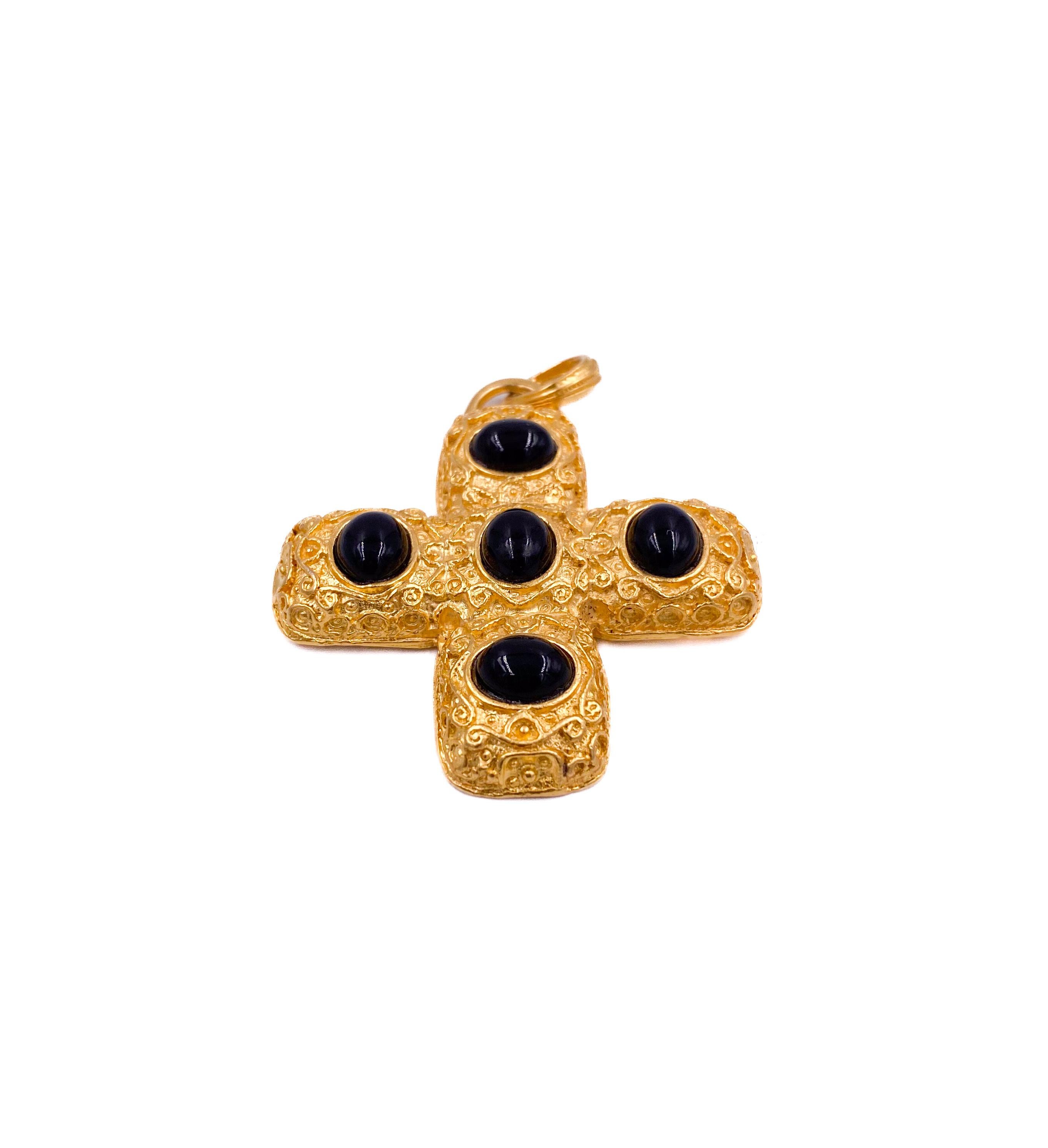 Elevate your style with this vintage Kenneth Jay Lane for QVC cross pendant, featuring striking black cabochons set in a rich gold-tone frame. This statement piece exudes timeless elegance and regal charm, perfect for pairing with any chain to