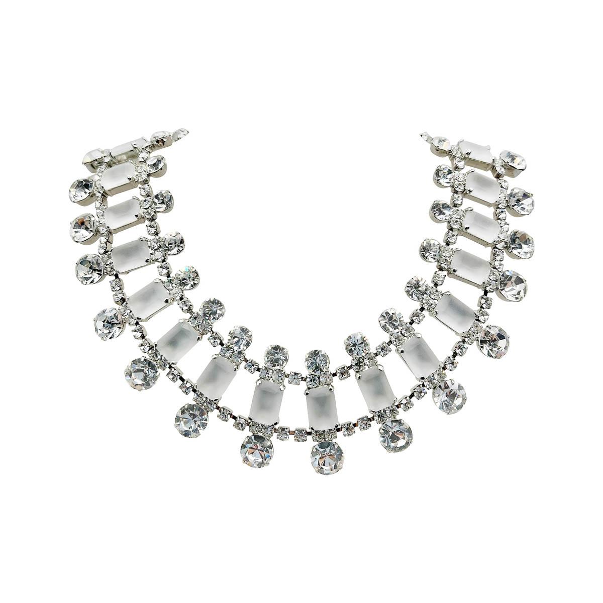 A spectacular Vintage KJL Ice Collar Necklace. A wonderful 360 design ensures sparkle from every angle. The broad collar set with opaque white emerald cut stones surrounded by chaton in varying sizes. The effect is stunning and ultra glamorous.