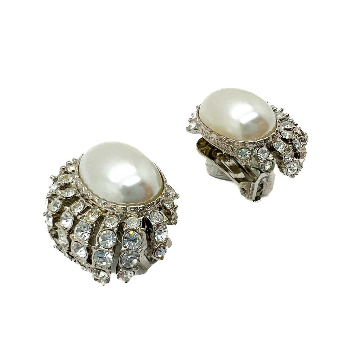 A pair of eternally chic Vintage Kenneth Jay Lane Mabe Pearl Earrings. Inspired by the fine jewels of the Art Deco era the earrings ooze style and class and cleverly emulate the ultimate combination of platinum, diamonds and pearls. Certain to