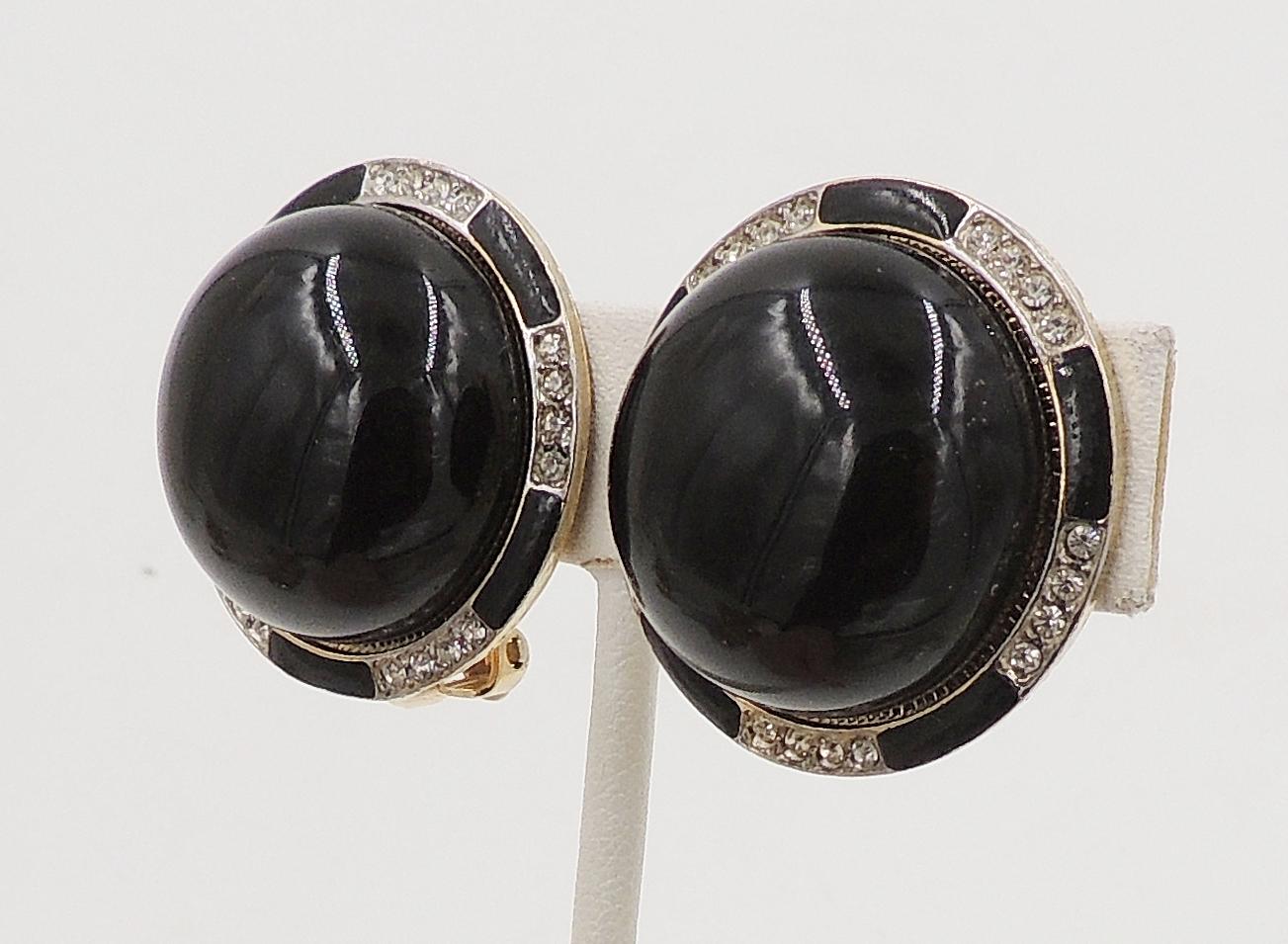 1980s Deco style goldtone cabochon faux-onyx rhinestone and clear rhinestones with black enamel clip back earrings. Marked 