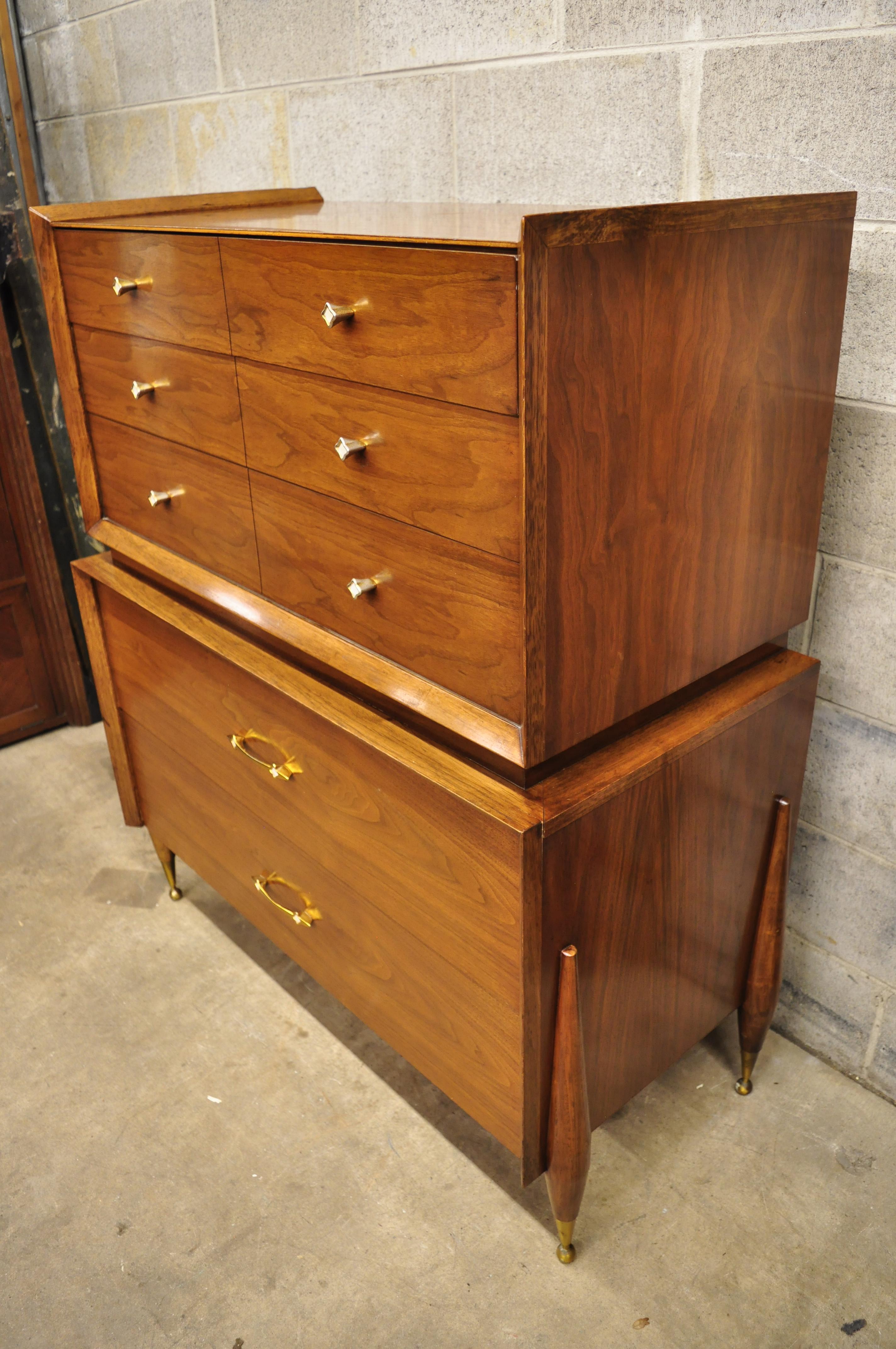 Kent Coffey The Auburn midcentury walnut atomic era tall chest dresser. Item features atomic era angled and tapered legs, brass capped ball form feet, beautiful wood grain, original signature, dovetailed drawers, very nice vintage item, sleek