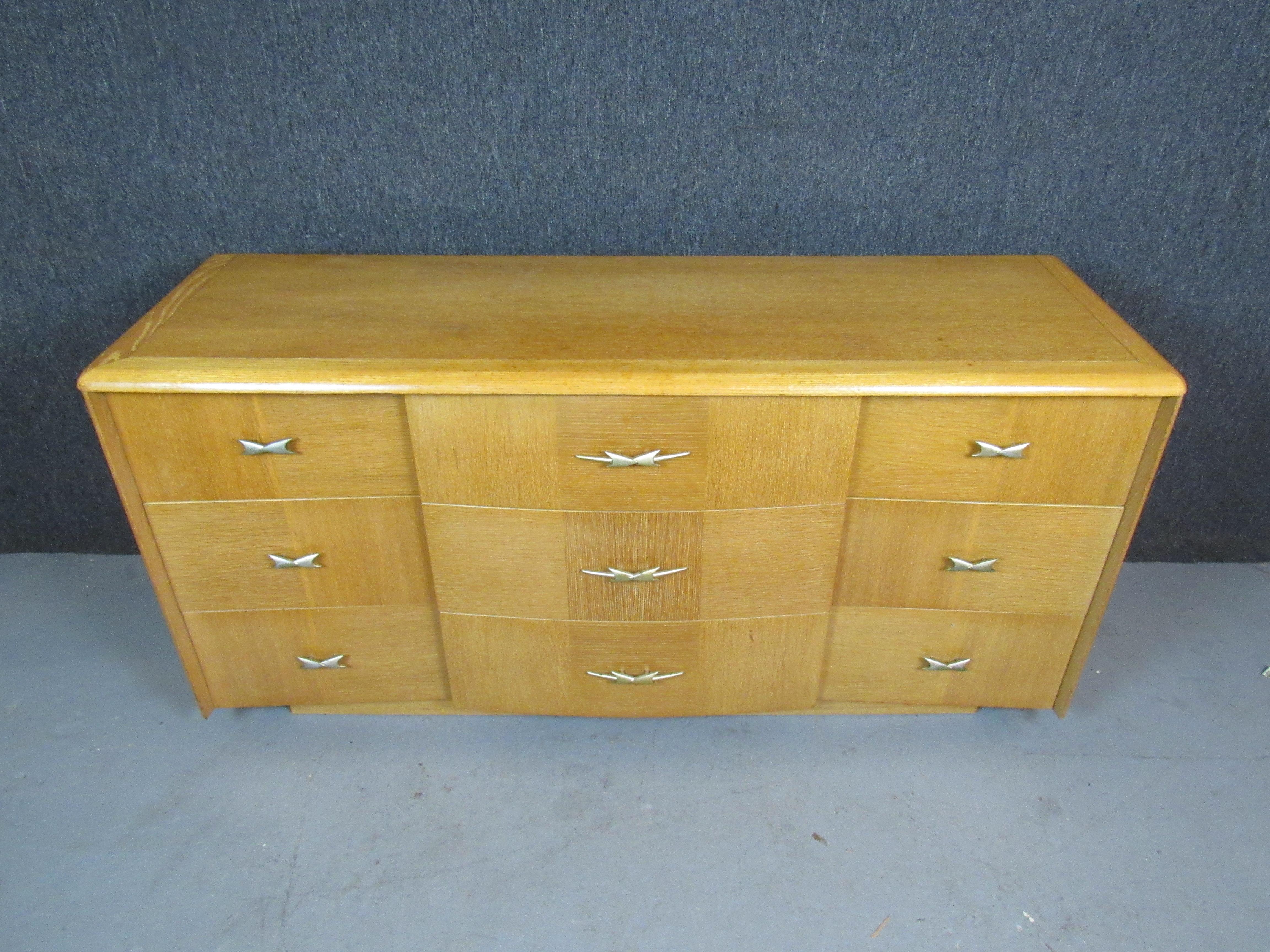 Don't miss out on this unique oak dresser from one of the biggest names in American mid-century modern!  This exceptional design from Kent Coffey's 