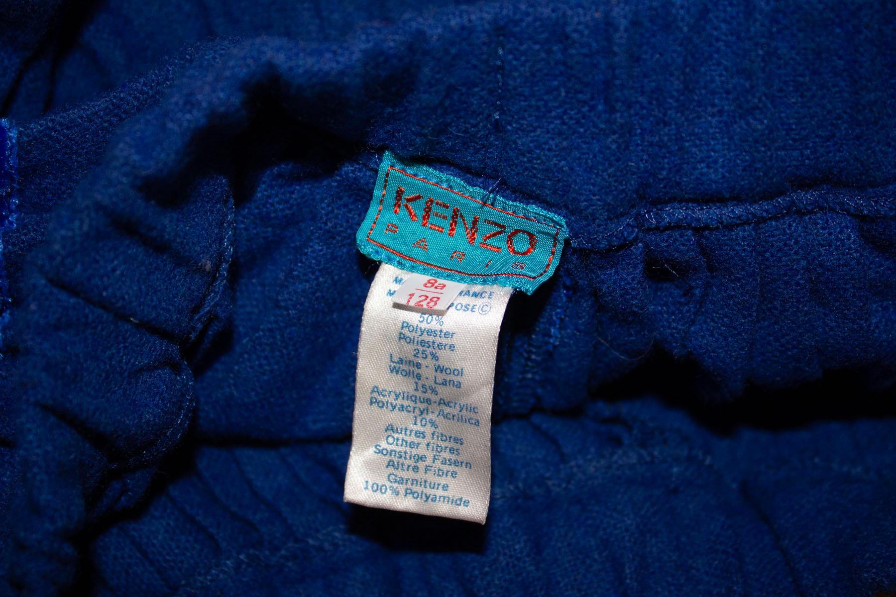 A fun vintage  mini skirt by Kenzo. In a vibrant blue, the skirt has a pocket on either side , one back pocket and belt hops. It is fully lined, and has a 3'' slit at the back.  
Size 38 Measurements: waist 26'', length 19''