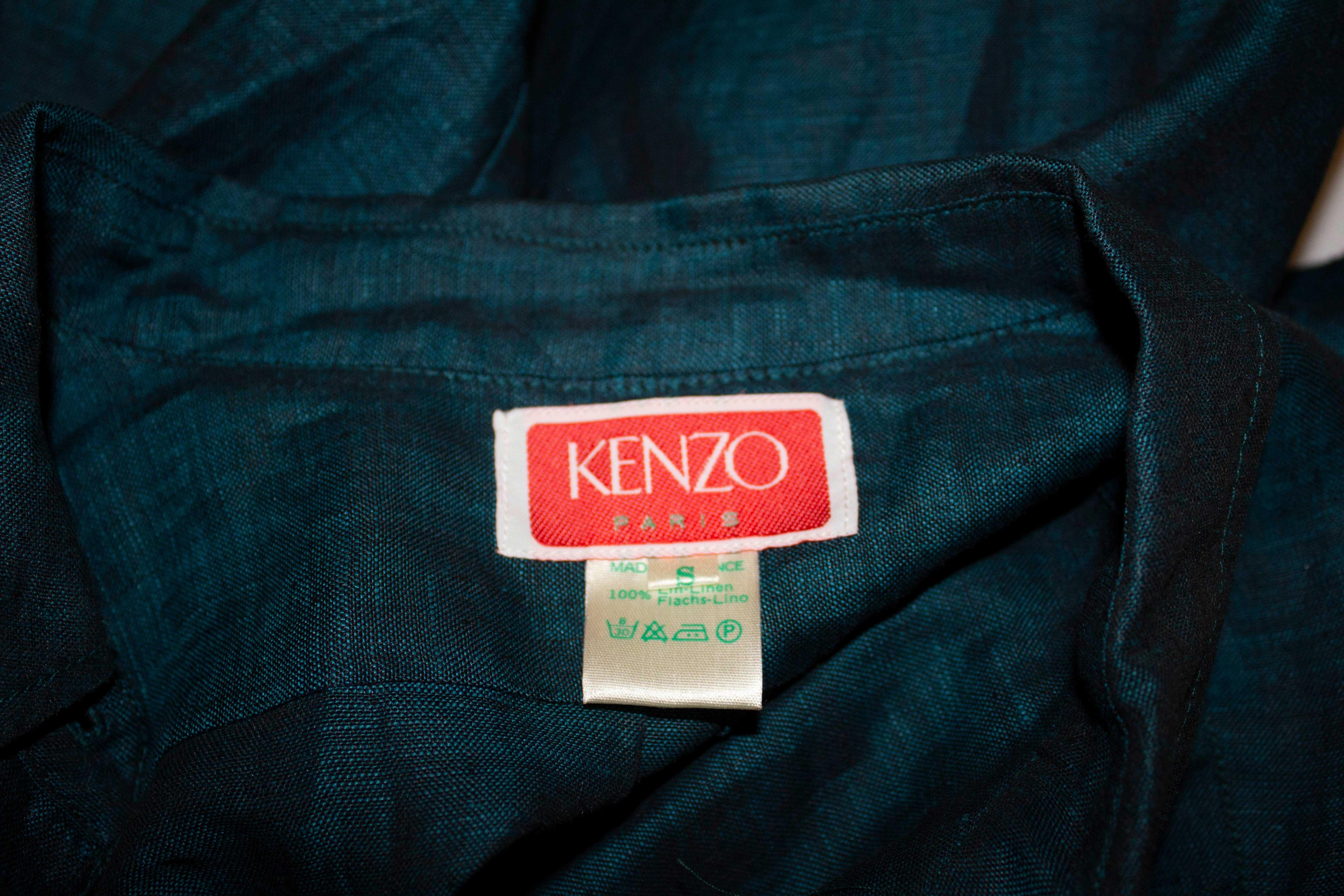 A great vintage shirt with frill detail by Kenzo., Paris. The linen shirt is in a wonderful sea green colour with button front with double ruffle detail, turn back cuffs and a small collar.  Marked size  S. Measurements: Bust 35'', length 24''