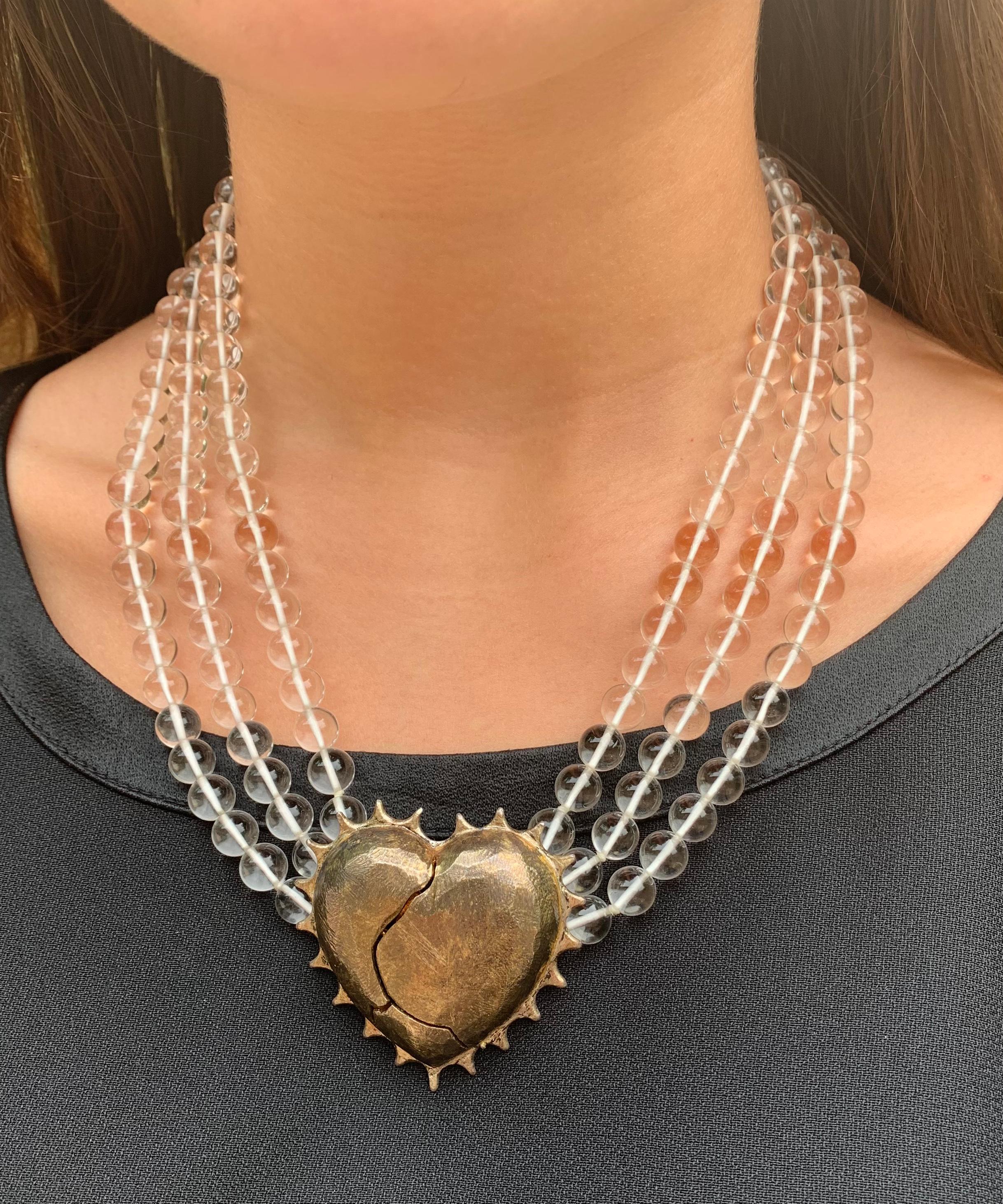 Estate Coup de Foudre/Love at First Sight statement necklace by Kerry MacBride.
Rock crystal and patinated hand wrought sterling silver necklace
centered by a large 50mm by 50mm stylized patinated hand wrought sterling silver heart rendered as