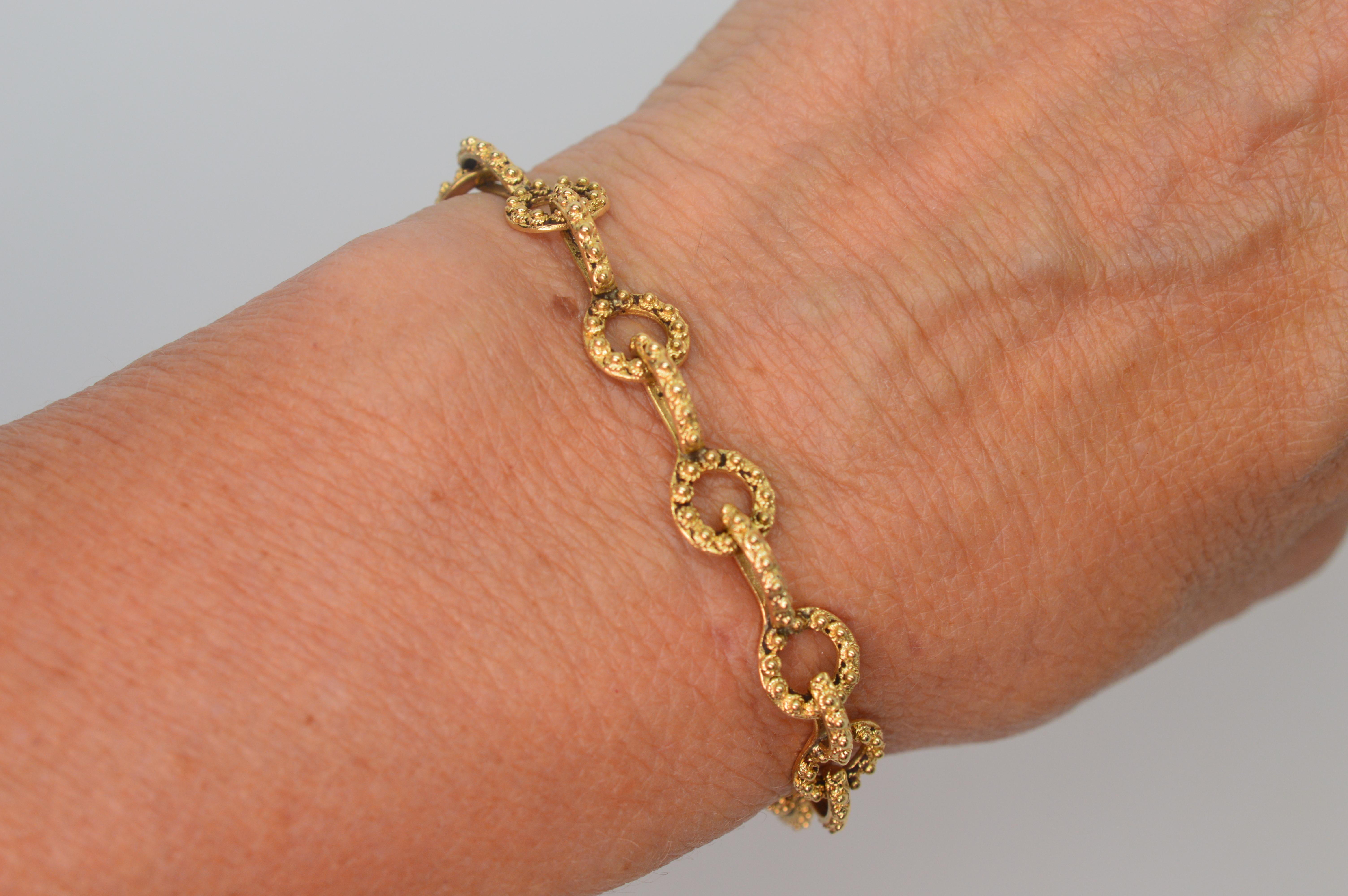 Hand-cast and crafted in fourteen carat yellow gold, this vintage keyhole link bracelet has a bit of an antique patina that gives a true artisan vibe.  
Lightweight and versatile, this 7 inch bracelet can be worn solo or to stack with other pieces