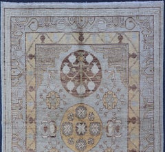 Khotan Rug with Central Medallion in Soft Blue, Golden Beige, and Warm Taupe