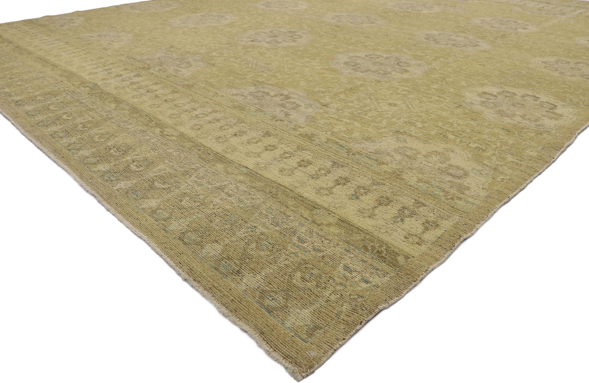 78153 vintage Khotan rug with European style 09'02 x 11'10. Cleverly composed with understated elegance in neutral colors, this hand knotted wool vintage Pakistani Khotan rug will take on a curated lived-in look that feels timeless while imparting a