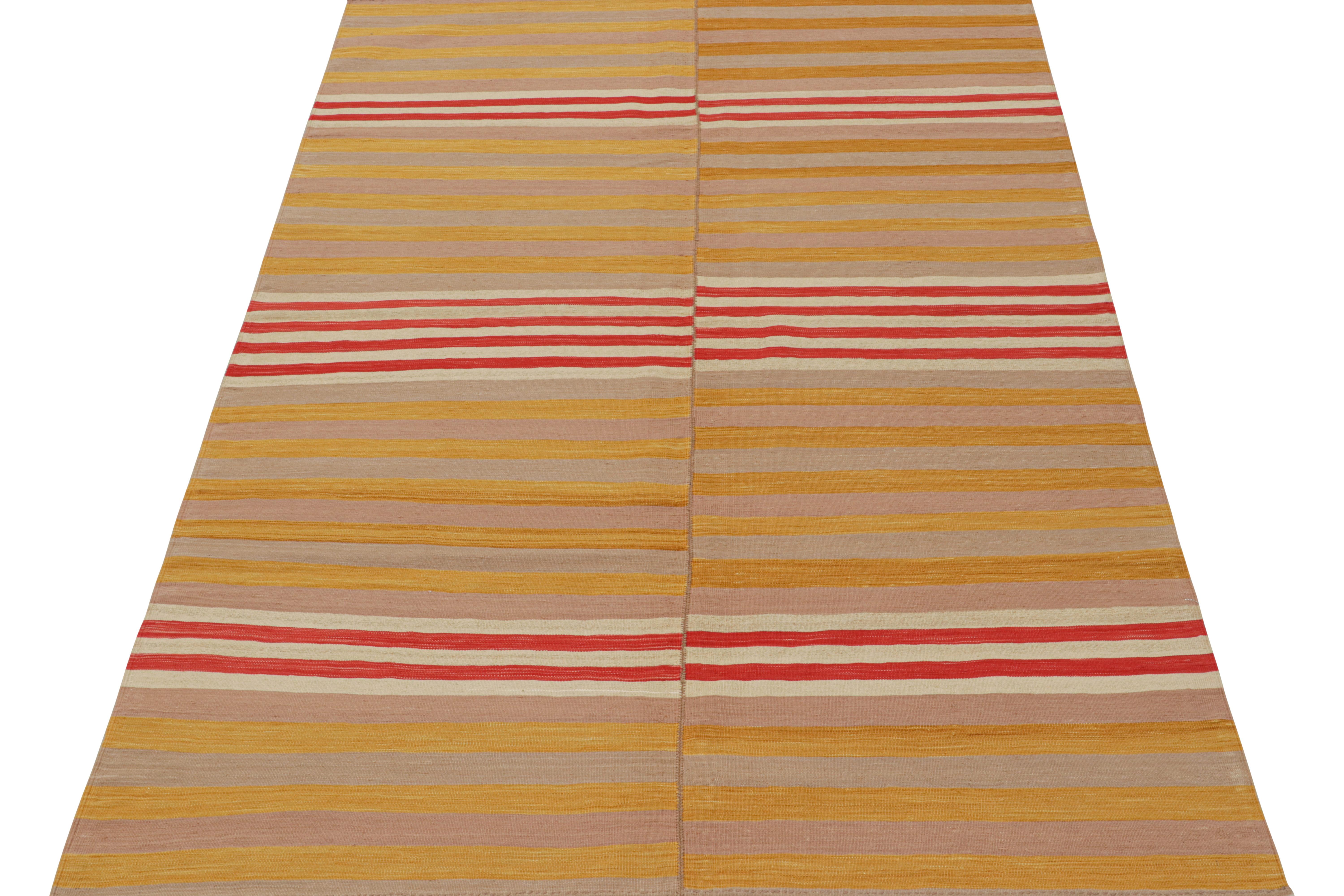 This vintage 6x8 kilim is a mid-century rug that originates from Turkey—handwoven in wool circa 1950-1960.

This particular piece is woven from two panels into one piece. Its design favors stripes in a most unusual play of gold and red one seldom