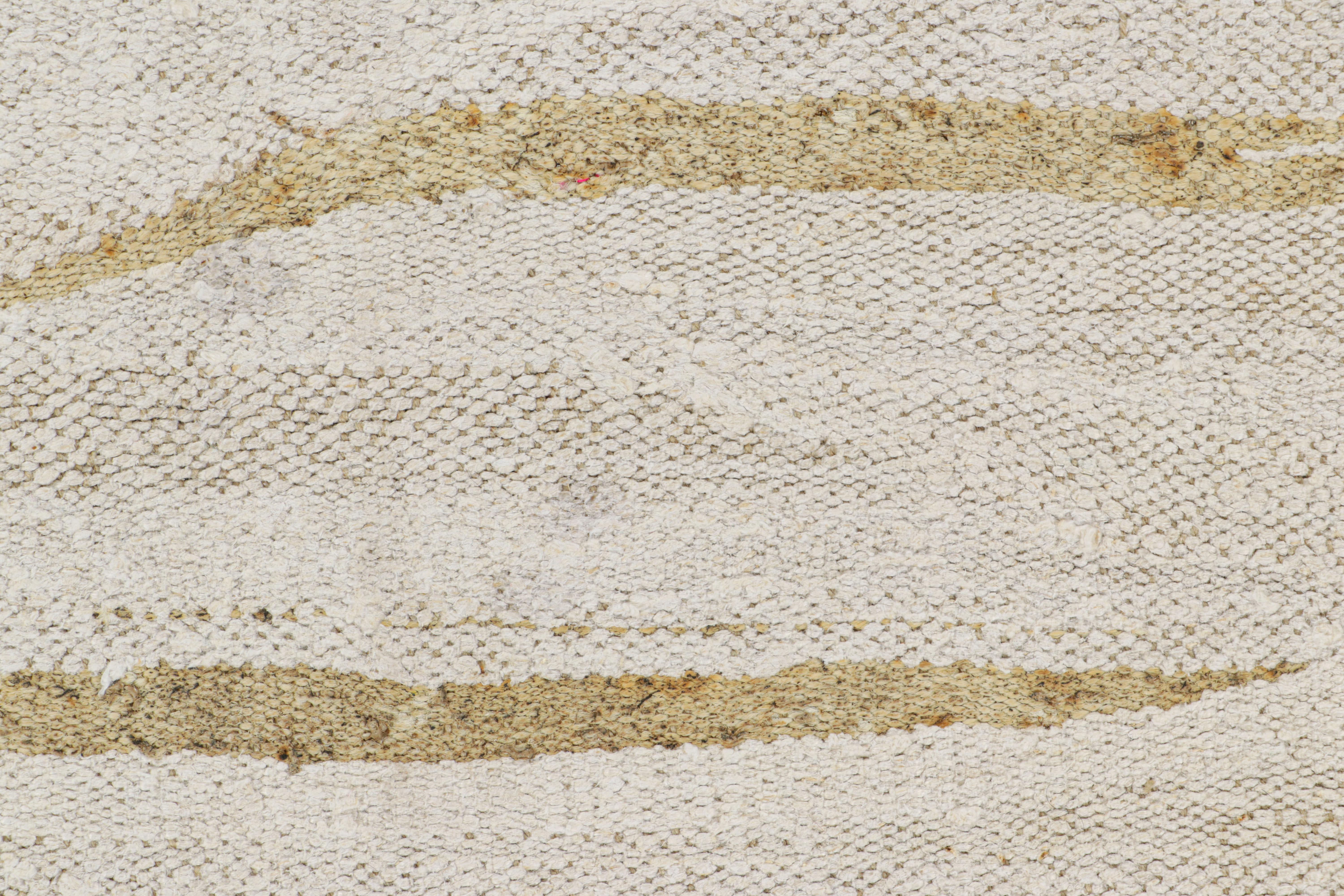 Handwoven in wool, circa 1950-1960, this 8x12 vintage kilim is among a special new curation of simple, near monochromatic flatweaves of bright color and a handsome flat weaving style, which has a beautiful finer boucle-like textural quality to it.