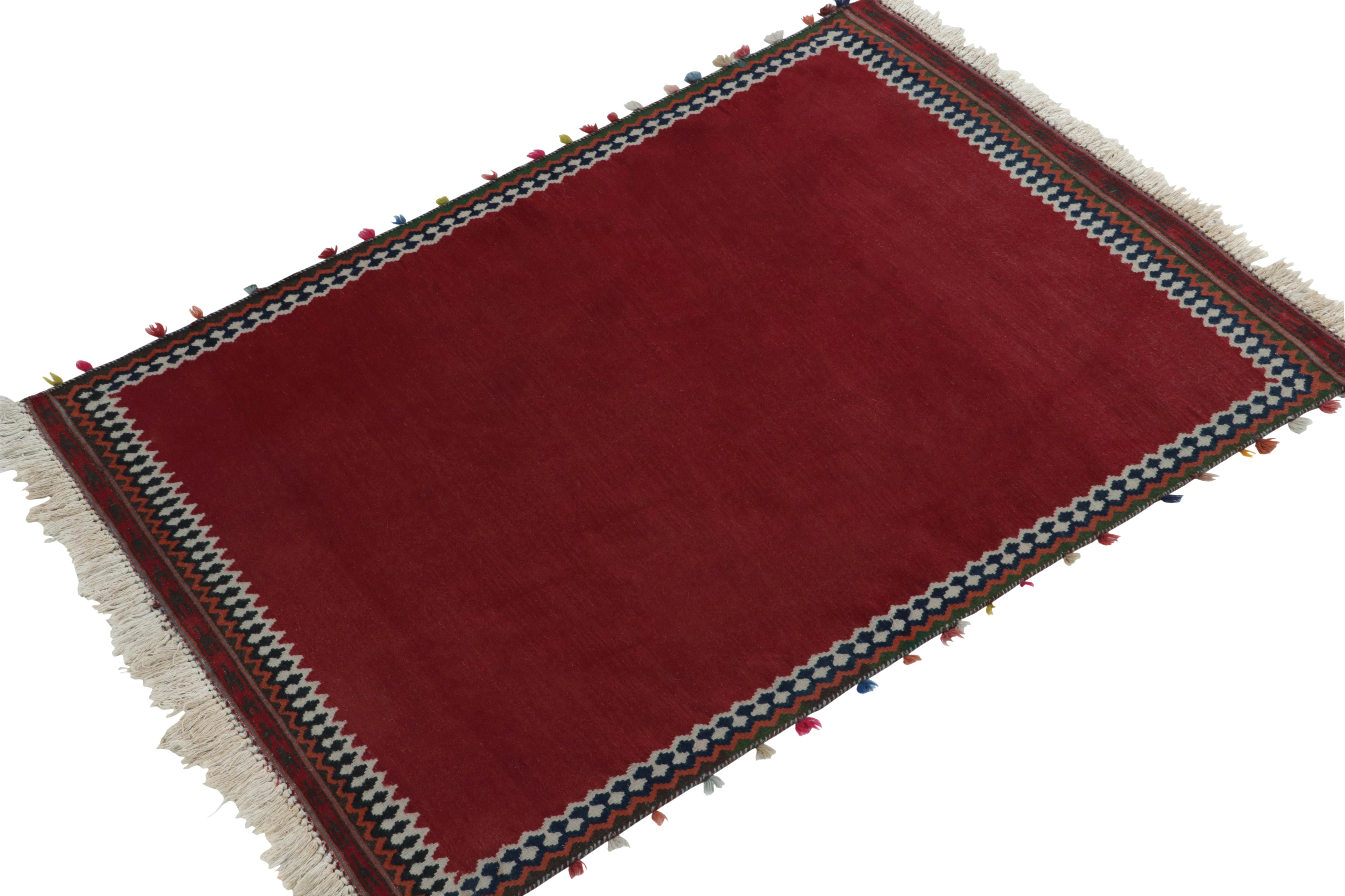 Celebrating unique mid-century aesthetics, a 3x5 vintage Kilim rug from our newly unveiled flatweave curations.

On the Design: Handwoven in wool circa 1950-1960, the Kilim rug features a rich red open field with deep blue & white borders