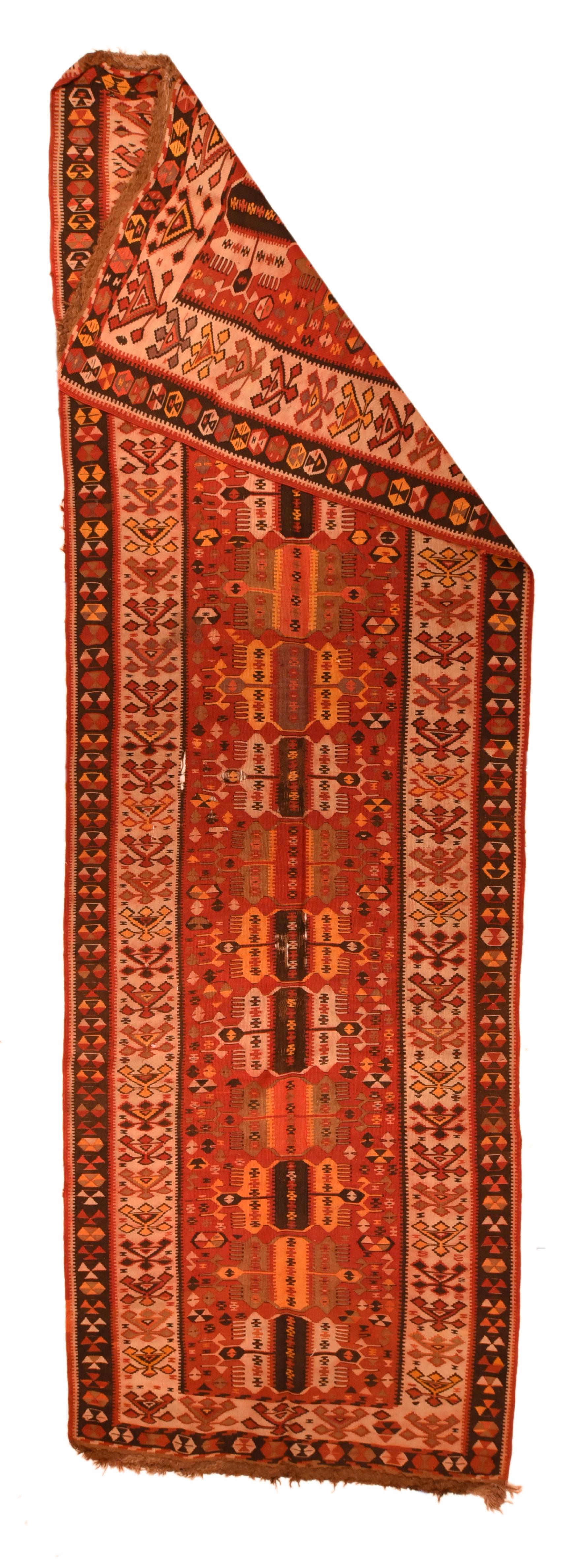 Vintage Kilim rug 3'10'' x 11'8''. This very unusual Anatolian pileless Kenare (runner) shows a rust-red field with 14 triplets of vertical cartouches in ecru, burnt salmon, brown-black and yellow, supported by a lateral scatter of small doubled
