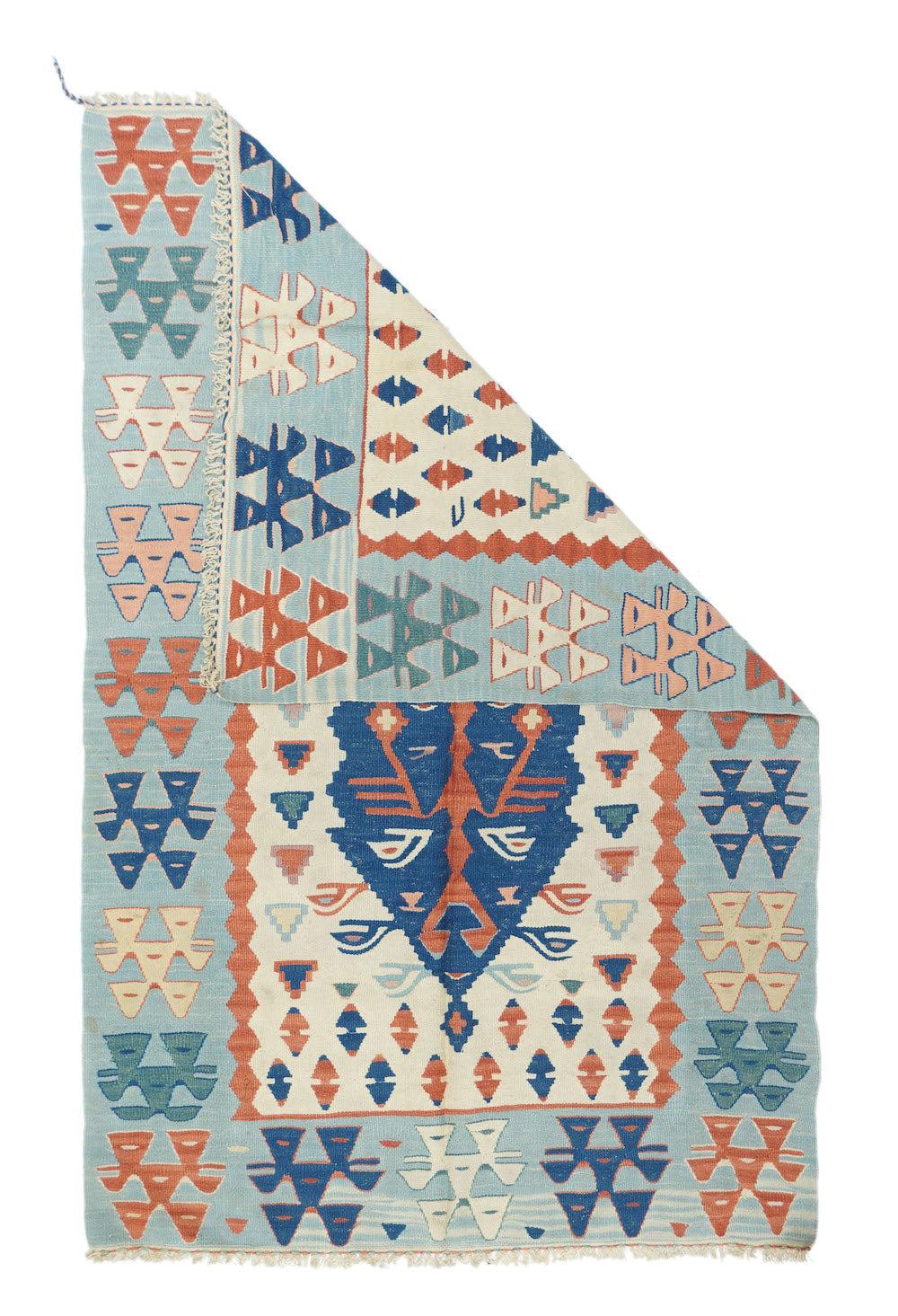 Vintage Kilim Rug 3'8'' x 5'8''. This vintage to recent Anatolian pileless prayer rug presents an ecru-ivory field in which floats a denim blue pointed niche panel centred by a red 