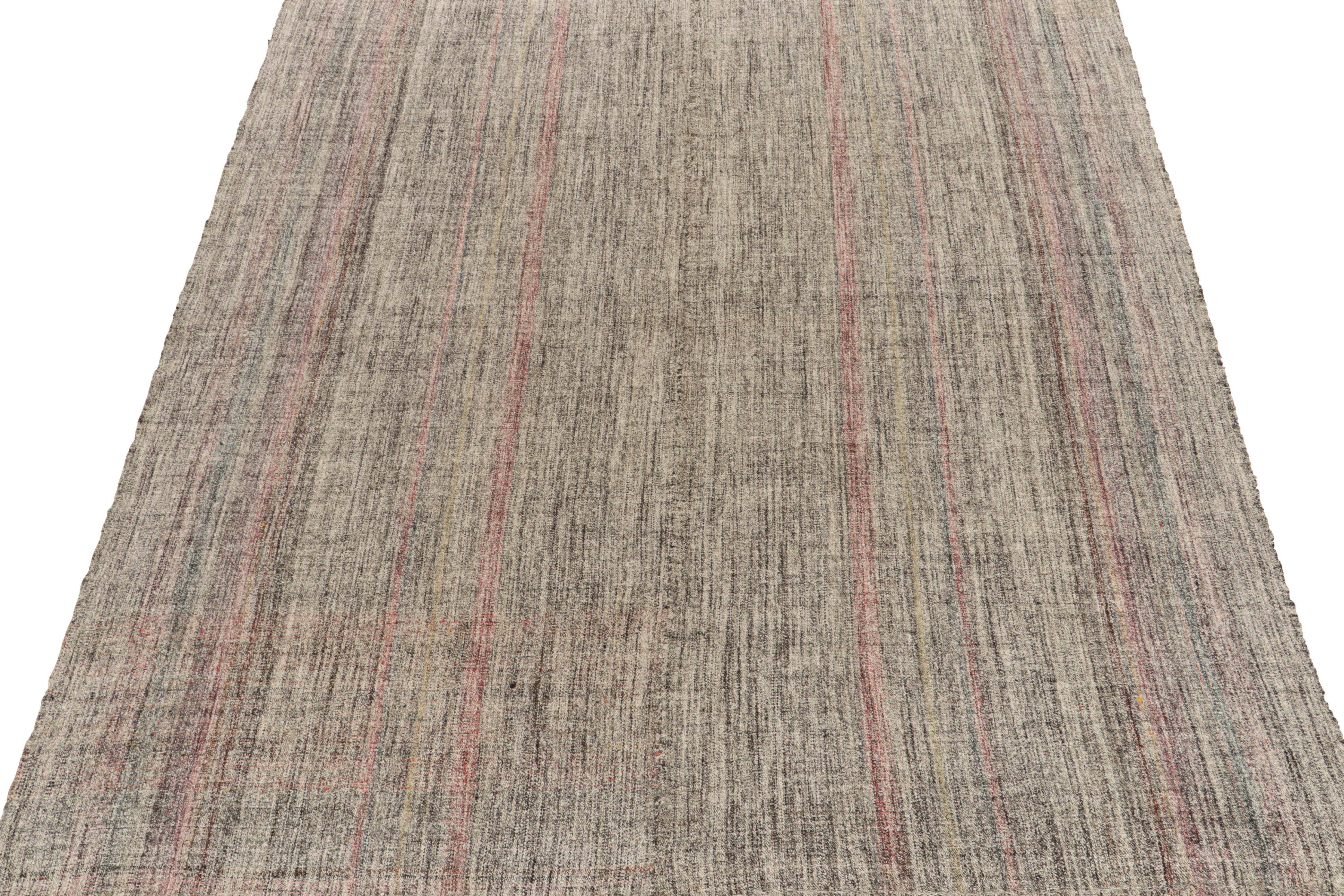 Connoting minimalist midcentury aesthetics, a vintage kilim rug from our flatweave selections. Originating from Turkey, the rug relishes midcentury aesthetics with white & black punctuated by light pink striations for a refreshing interpretation in