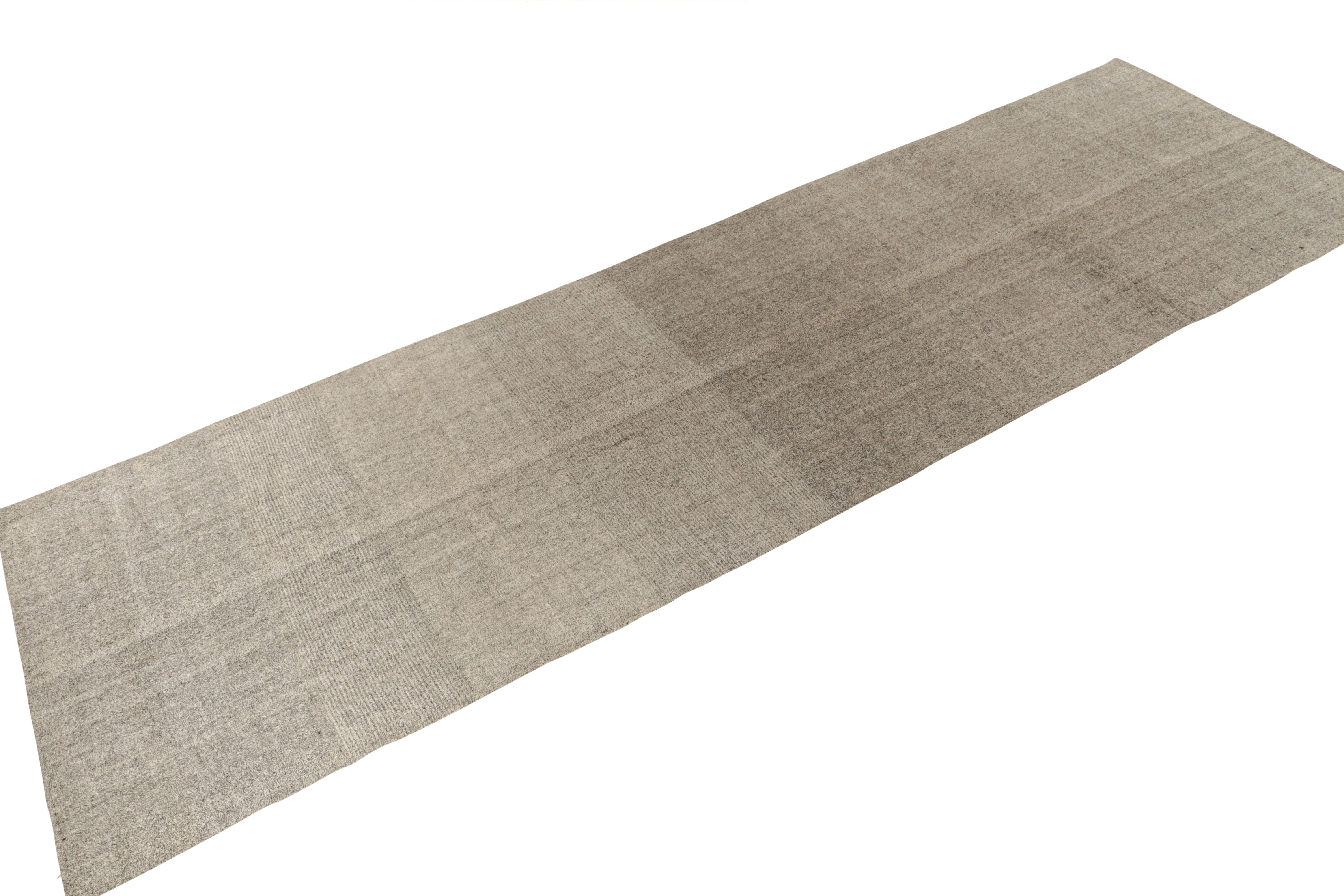 Connoting minimalist midcentury aesthetics, a vintage kilim rug from our flatweave selections. Originating from Turkey, the rug relishes midcentury aesthetics with white & black never seen before in a rare 5x18 length. From the 1970s, a gallery size
