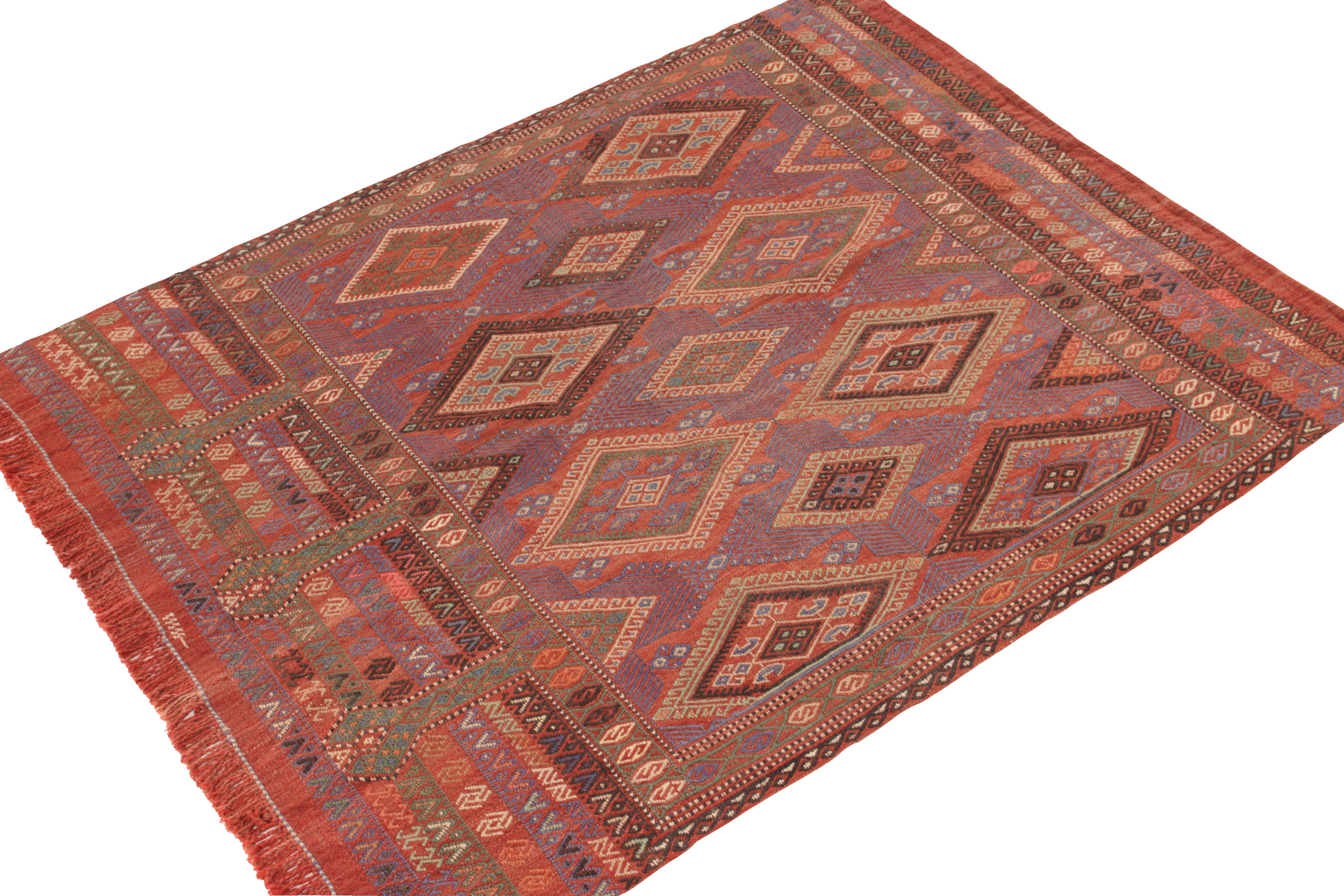 This vintage 4×6 Kilim is a rare tribal curation in Rug & Kilim’s collection. Handwoven in wool, it originates from Turkey circa 1950-1960.

The design favors vibrant colors in a polychromatic style, though oranges and blues are among the dominant