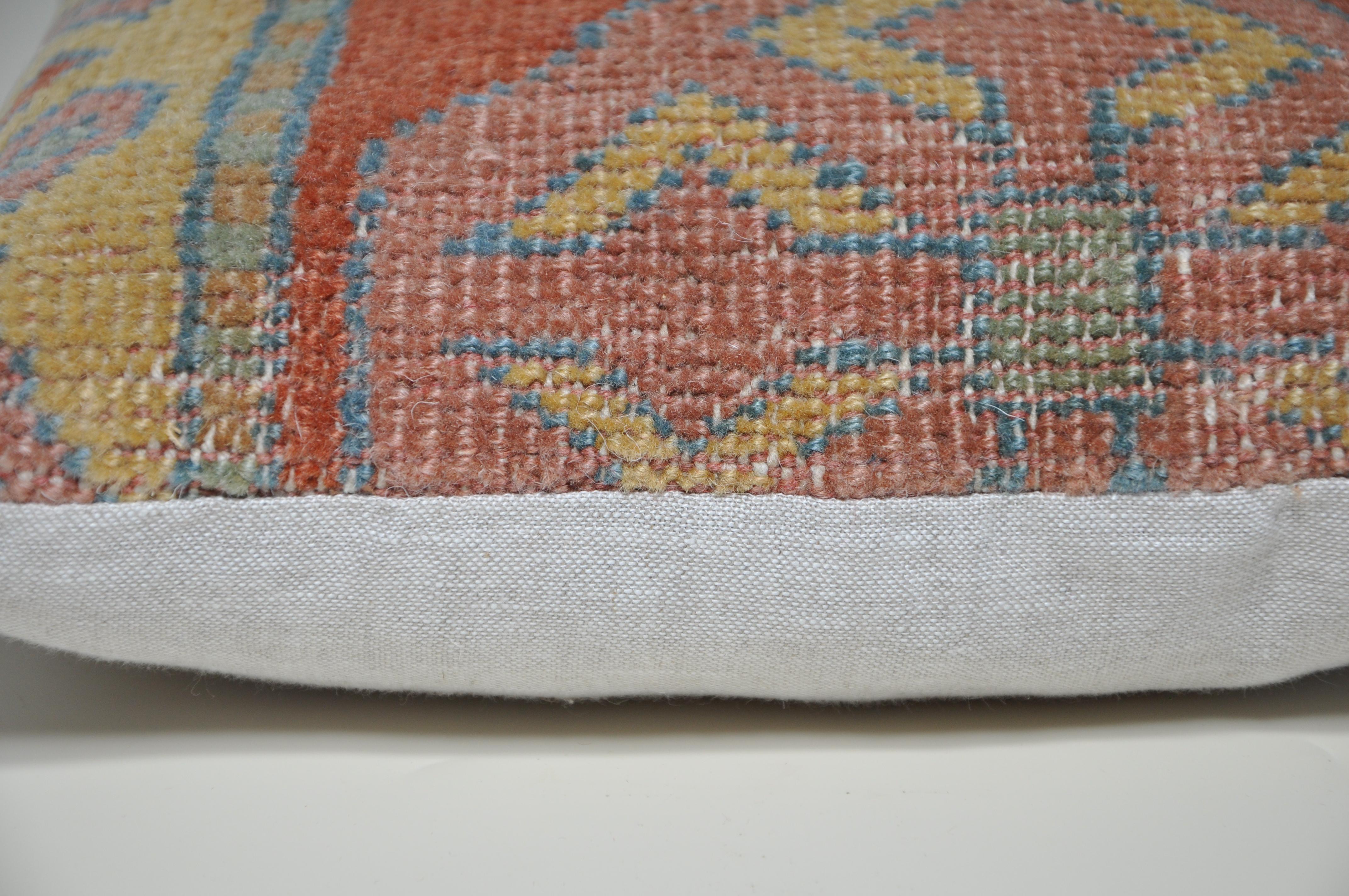 Luxury pillow created from an exquisite piece of vintage kilim rug combined with Irish Linen by Irish designer Katie Larmour. Unique and one-of-a-kind. 

Each cushion is constructed in Ireland.
Filled with a new, custom-made, plush duck feather