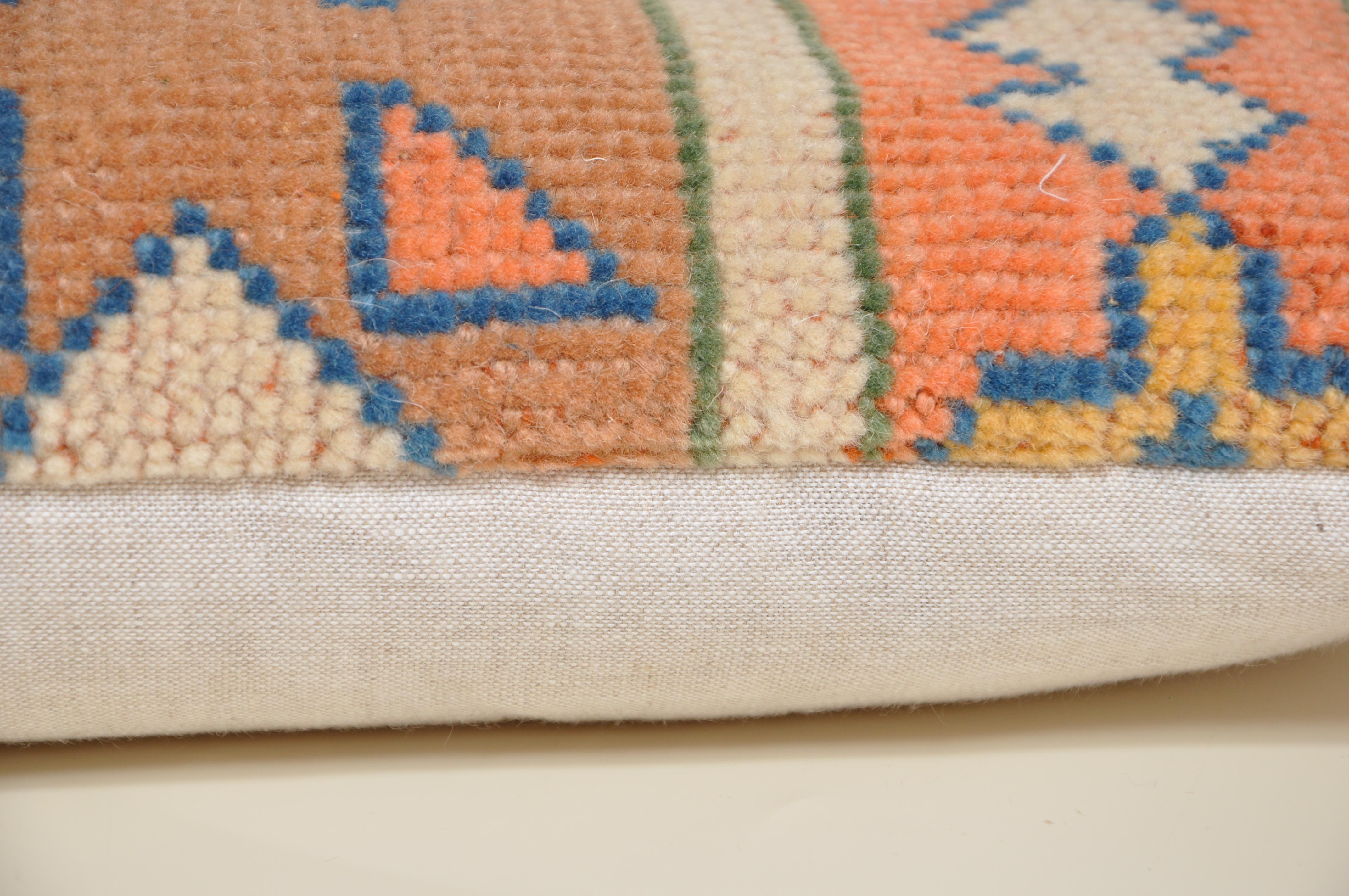 Luxury pillow created from an exquisite piece of vintage kilim rug combined with Irish Linen by Irish designer Katie Larmour. Unique and one-of-a-kind. 

Each cushion is constructed in Ireland.
Filled with a new, custom-made, plush duck feather