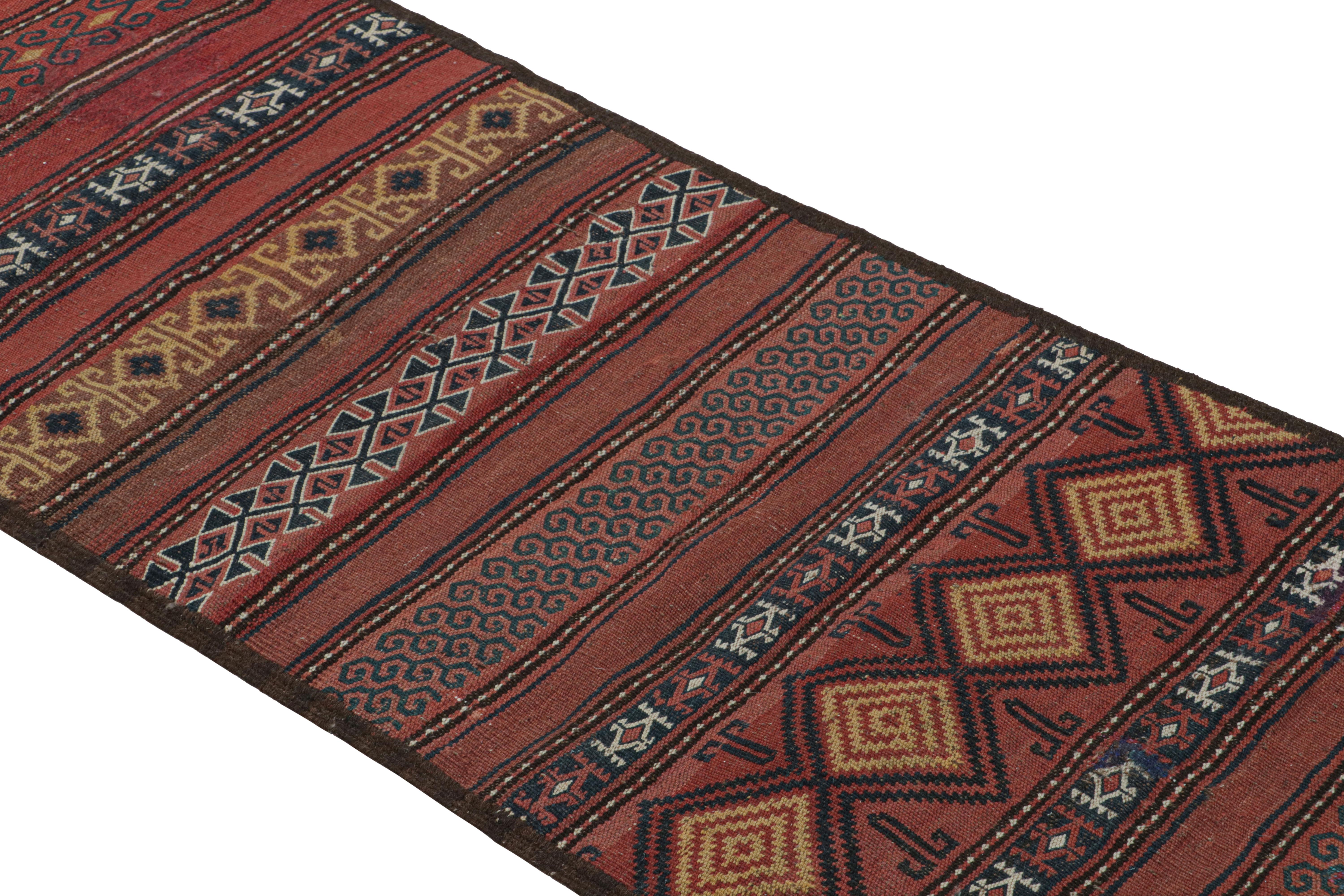 Made with handwoven in Turkey circa 1950-1960, this 2x9 vintage Kilim runner rug is a unique piece, which draws inspiration from Uzbek rug designs. 

On the Design: 

Brick red tones underscore a play of thin stripes and large geometric patterns,