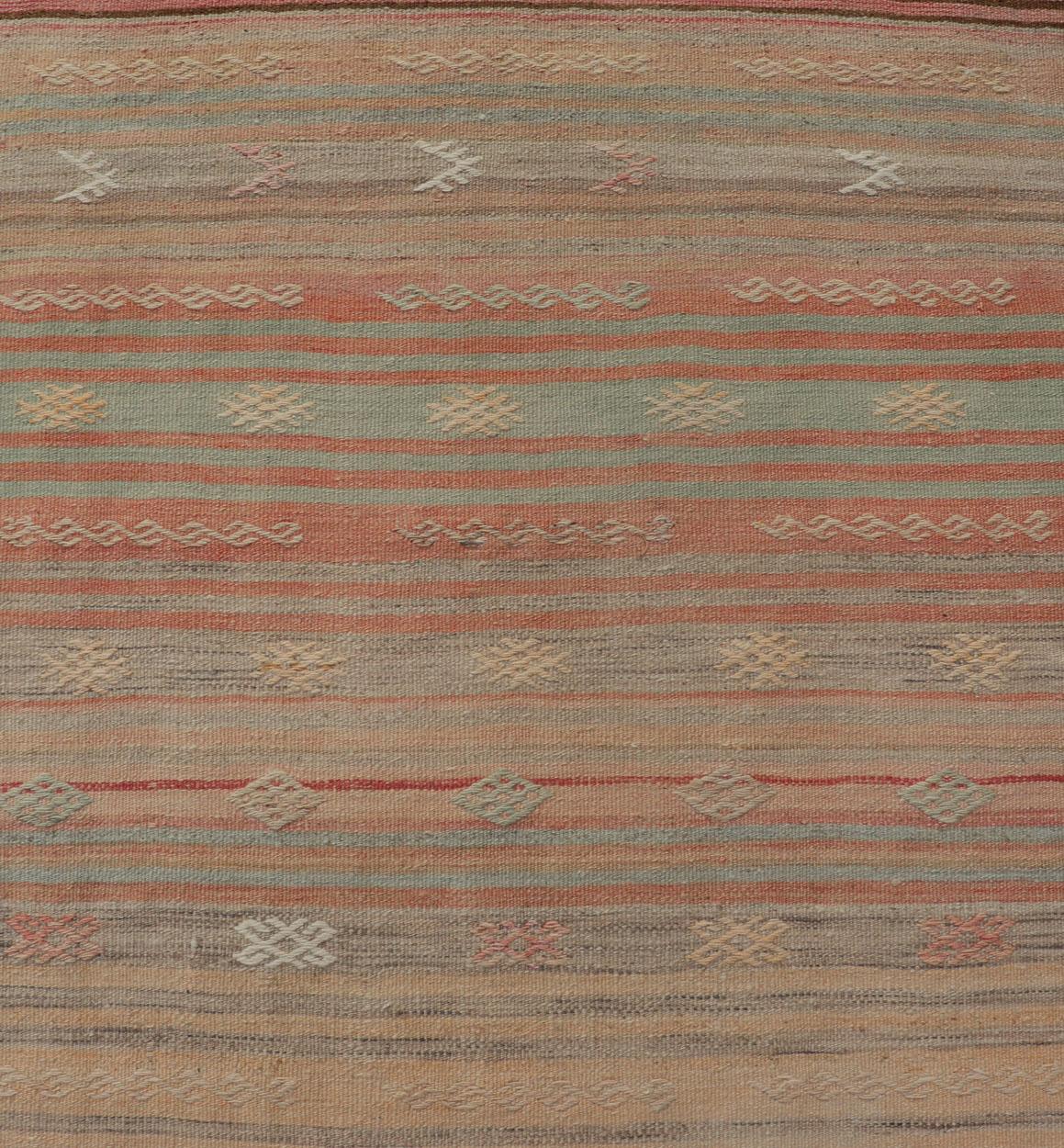 Vintage Kilim runner with stripes and geometric Tribal motifs in light tones. Keivan Woven Arts / rug EN-P13732, country of origin / type: Turkey / Kilim, circa mid-20th century.

This vintage flat-woven kilim runner features a minimalist design