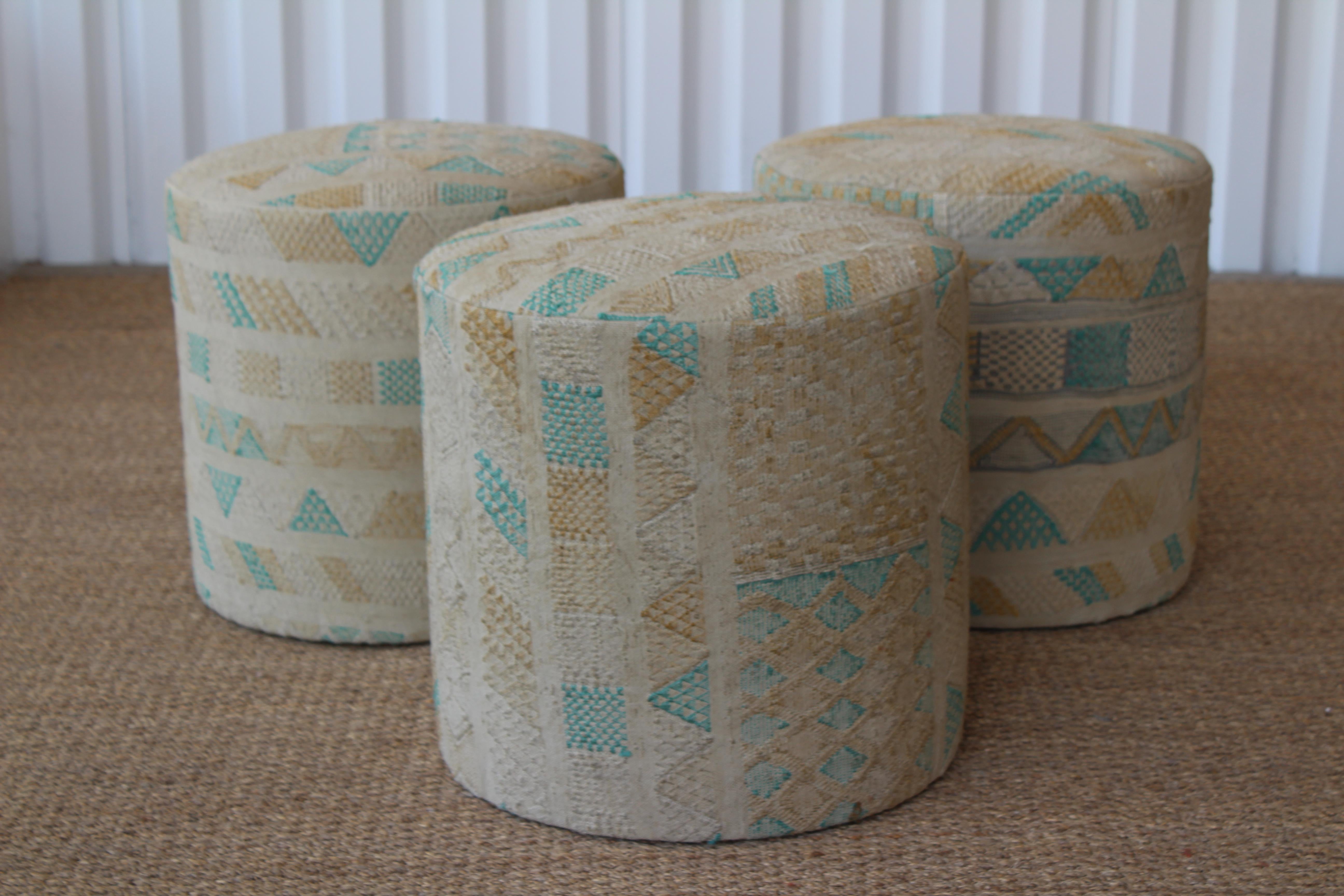 Custom made stools upholstered in a vintage woven Turkish kilim rug. The rug used for upholstery is most likely from the 1950s and shows signs of wear. It is slightly faded but over all in good condition. Three available, sold individually.