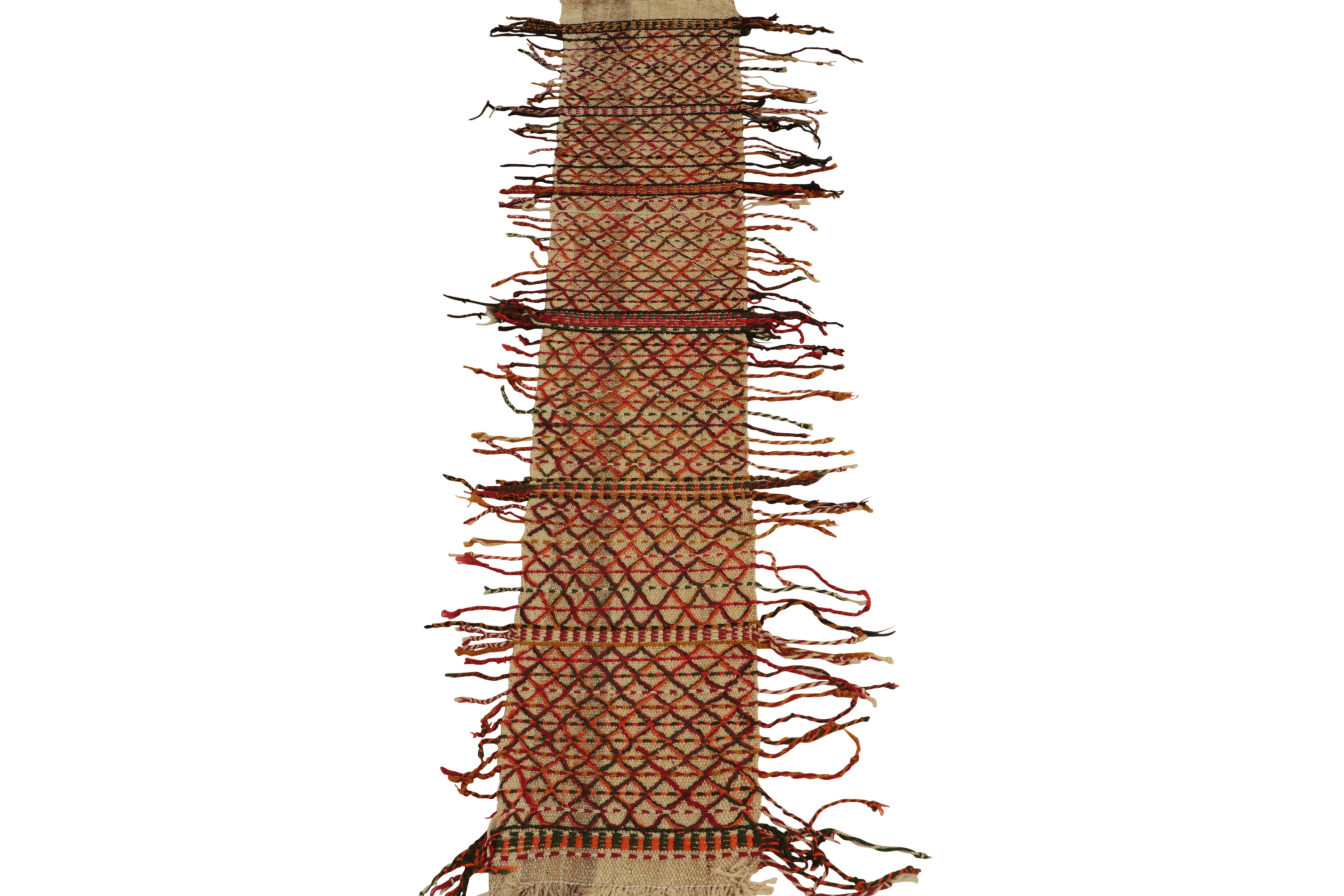 This vintage 2x8 tribal Kilim is a unique mid-century curation, and an ideal table runner given its narrow size. Handwoven in wool, it originates from Turkey circa 1950-1960.

Further On the Design: 

This flat weave has a beige undertone, which