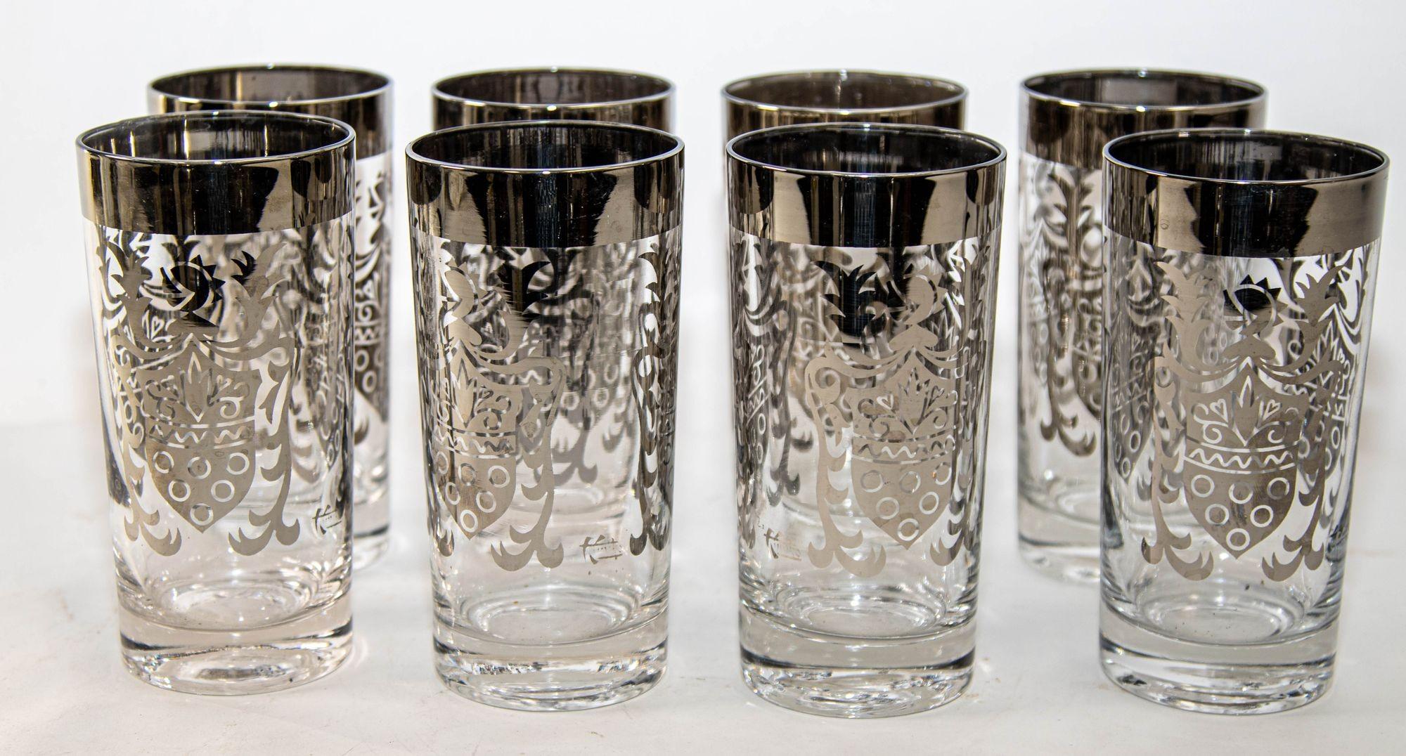 Vintage Set of 8 Kimiko highball glasses from the 1960s, featuring a silver band and a shield crest accent.
The tumbler glasses come with a carrying storage caddy.
Set of 8 Vintage Mid-Century Kimiko highball glasses, each signed and featuring a