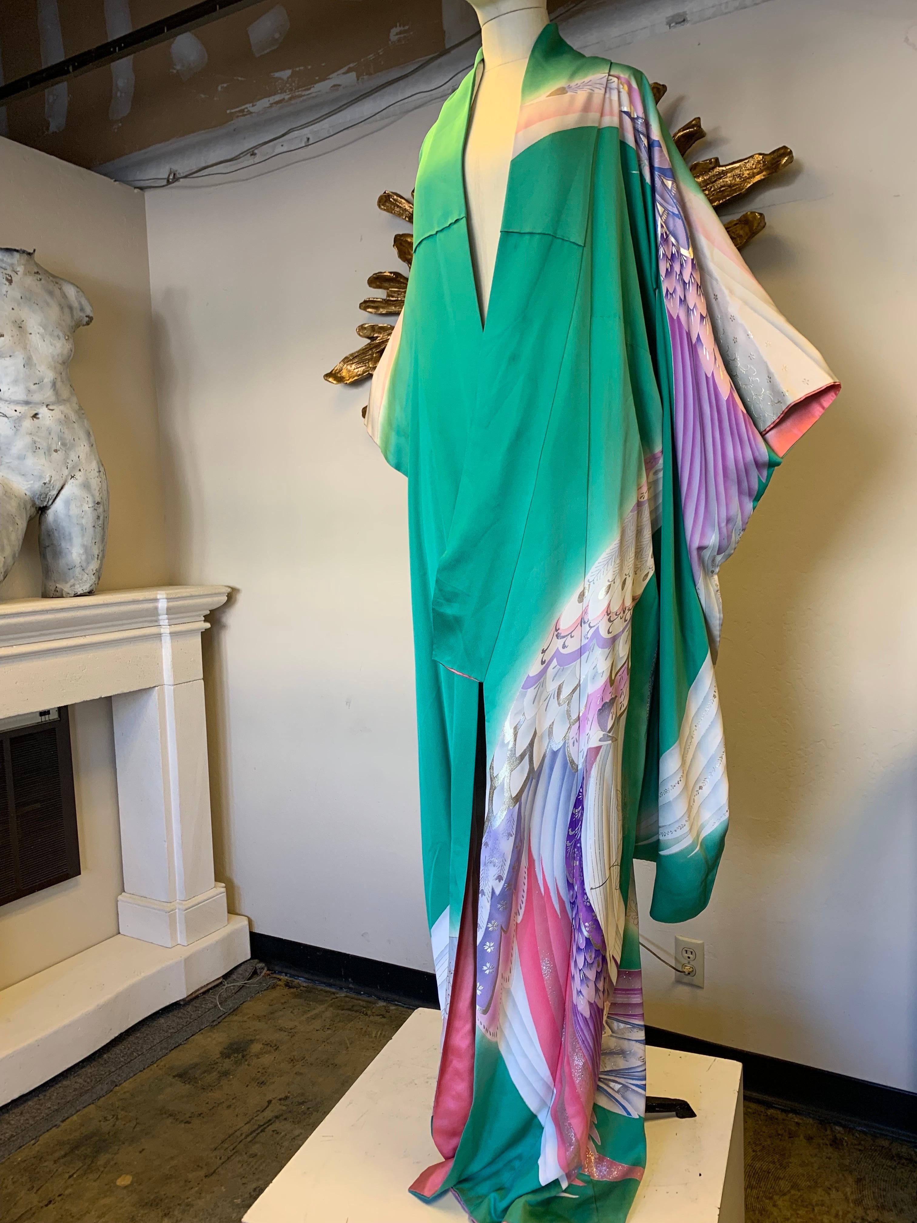 Vintage Kimono: Jade green silk, traditionally cut (draped in photo to show pattern) with dramatic airbrushed lavender, pink and silver metallic wing motifs. Gorgeous! Size up to Large.