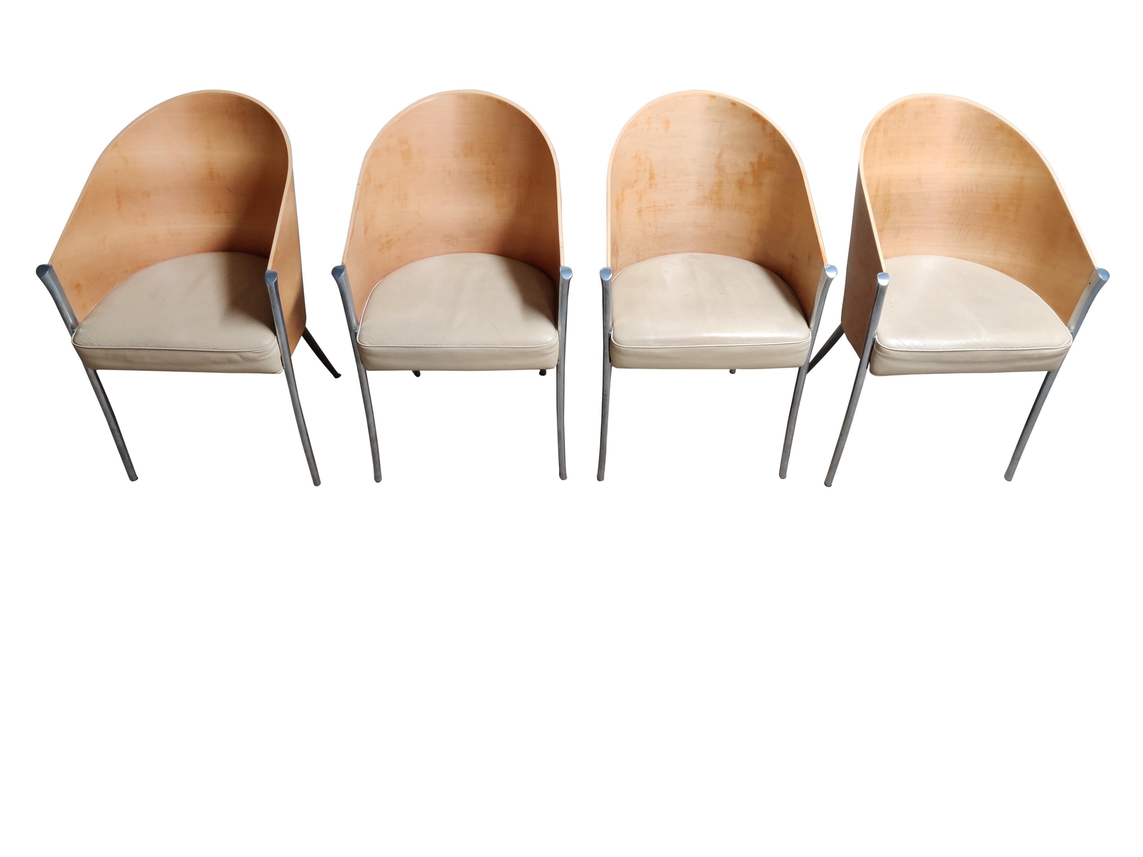This set of 4 king Costes is the second version of the Costes chair, featuring 4 legs rather than the original three.

Walnut wooden chair with sand color leather seats and an elegant cast aluminum frame.

The chairs are in good