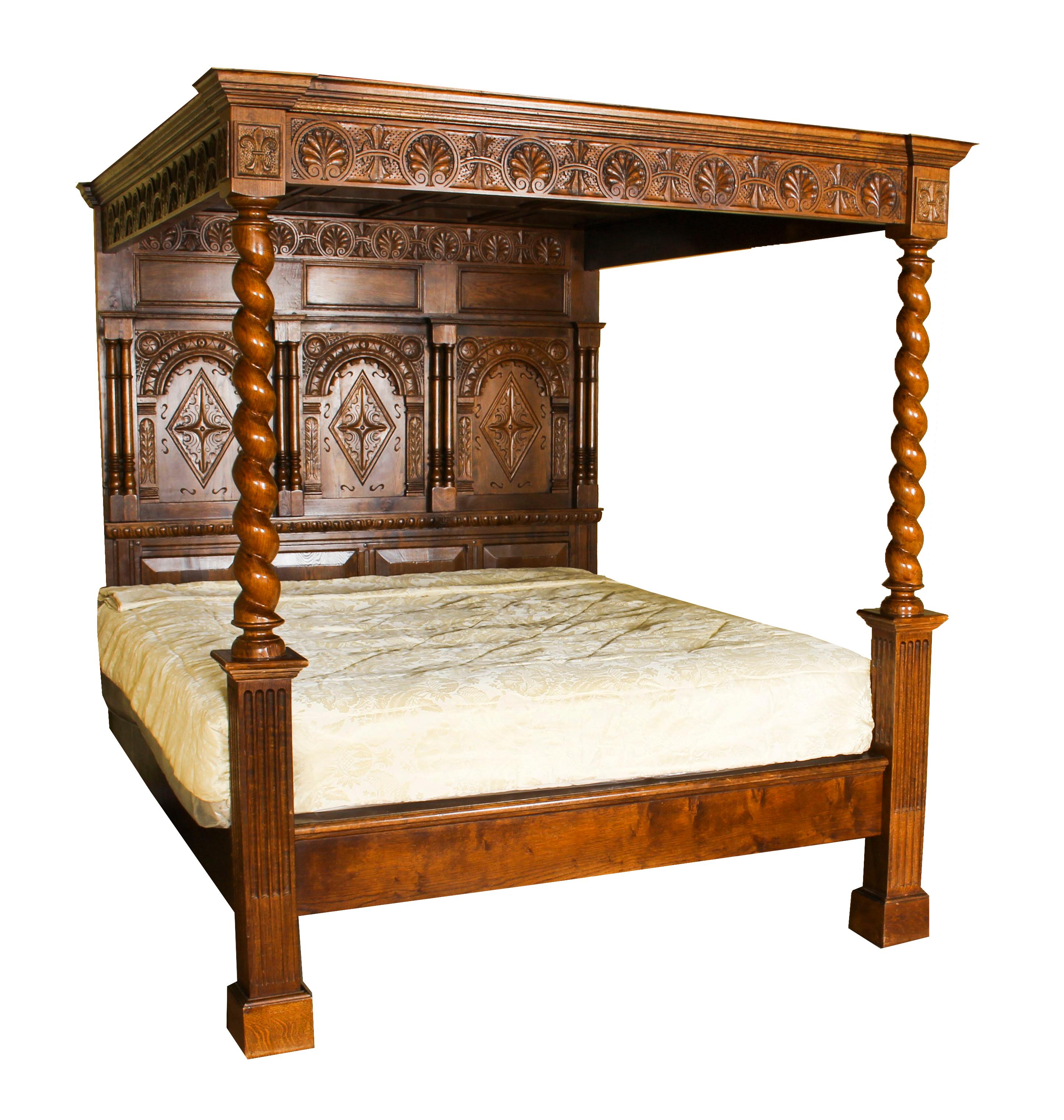 This is an exquisite vintage oak four poster bed with canopy, mid-20th century in date, with a pair of antique bedside cabinets. 

It has a beautiful headboard feature panels with carved crests, the two columns are carved in the form of barley twist