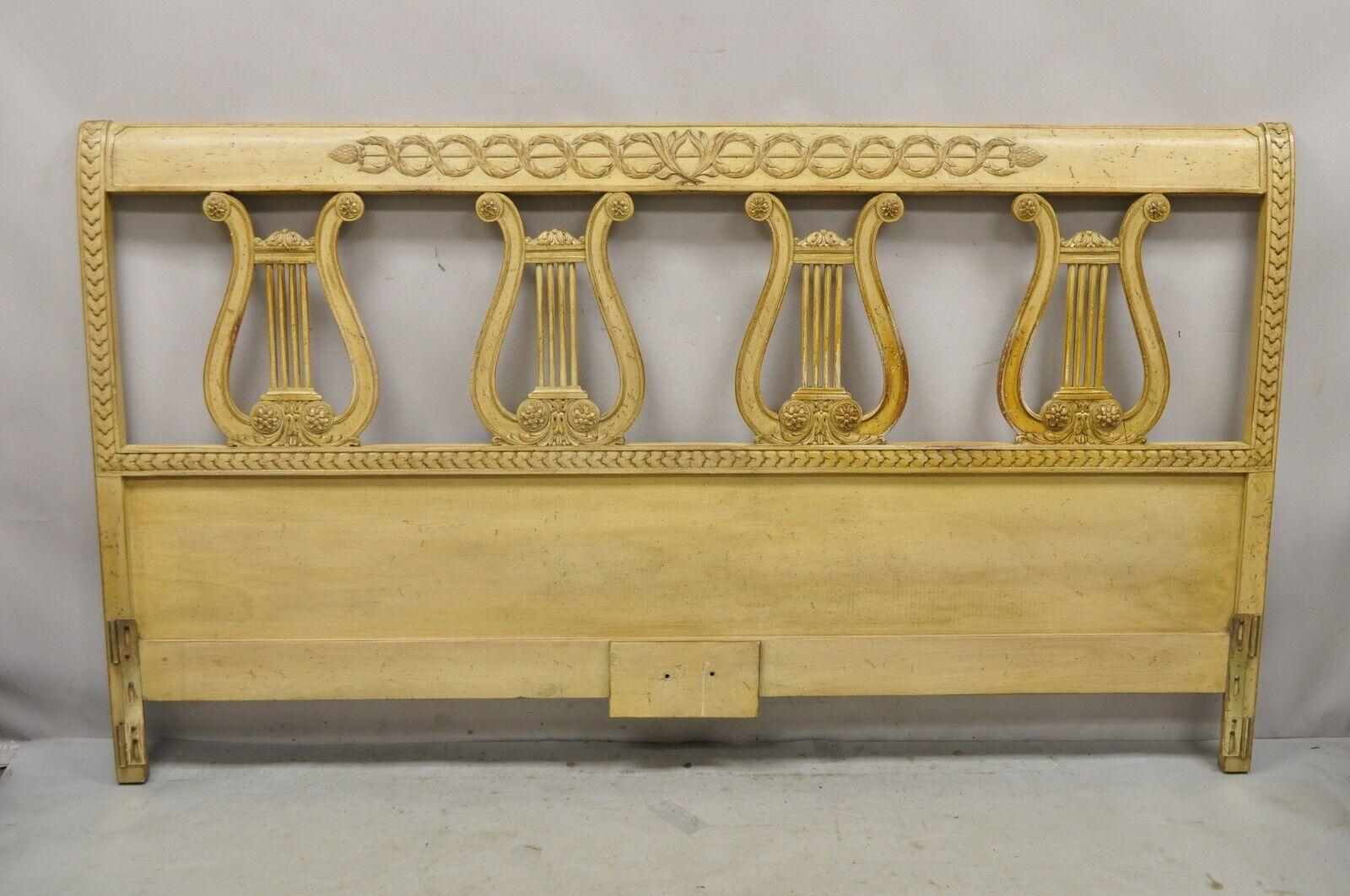 Vintage King Size Neoclassical Style Carved Lyre Harp Wooden Bed Headboard. Item features (4) carved wood harps, solid wood construction, distressed finish, very nice vintage item, great style and form. circa Mid-20th century. Measurements: 45.5
