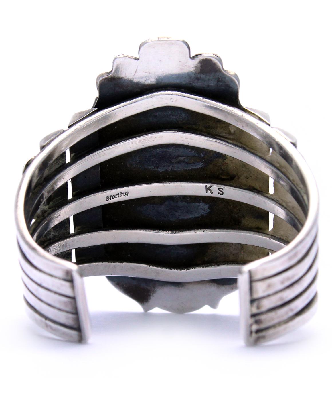 VINTAGE Kirk Smith Navajo Turquoise Sterling Silver Cuff Bracelet 

This stunning turquoise cuff bracelet was made by the artist Kirk Smith. It weighs 121.8 grams, and measures about 2.5