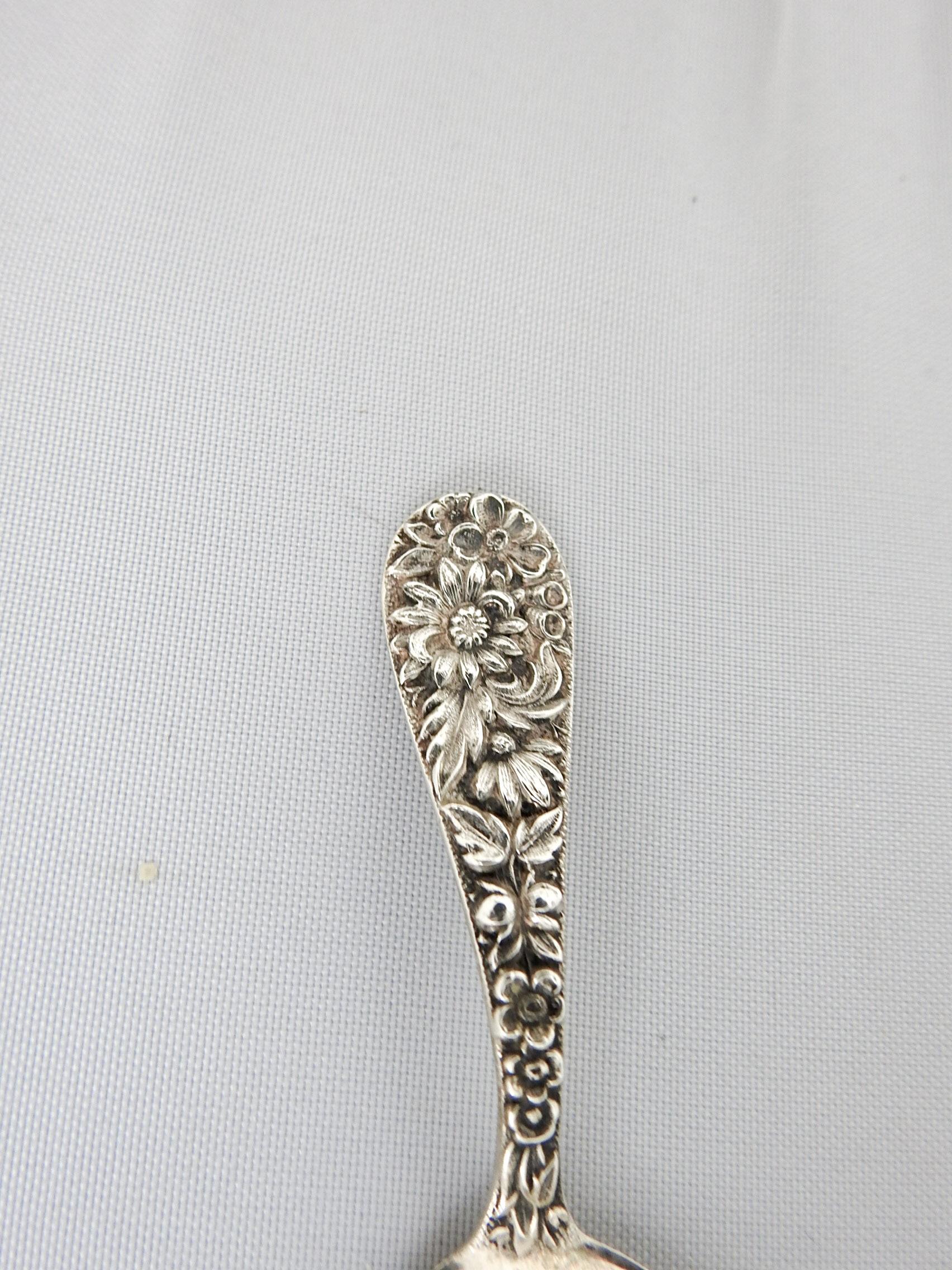 Vintage early 20th century Kirk & Son sterling silver baby spoon in Repoussé pattern. Marked on back, minor wear.