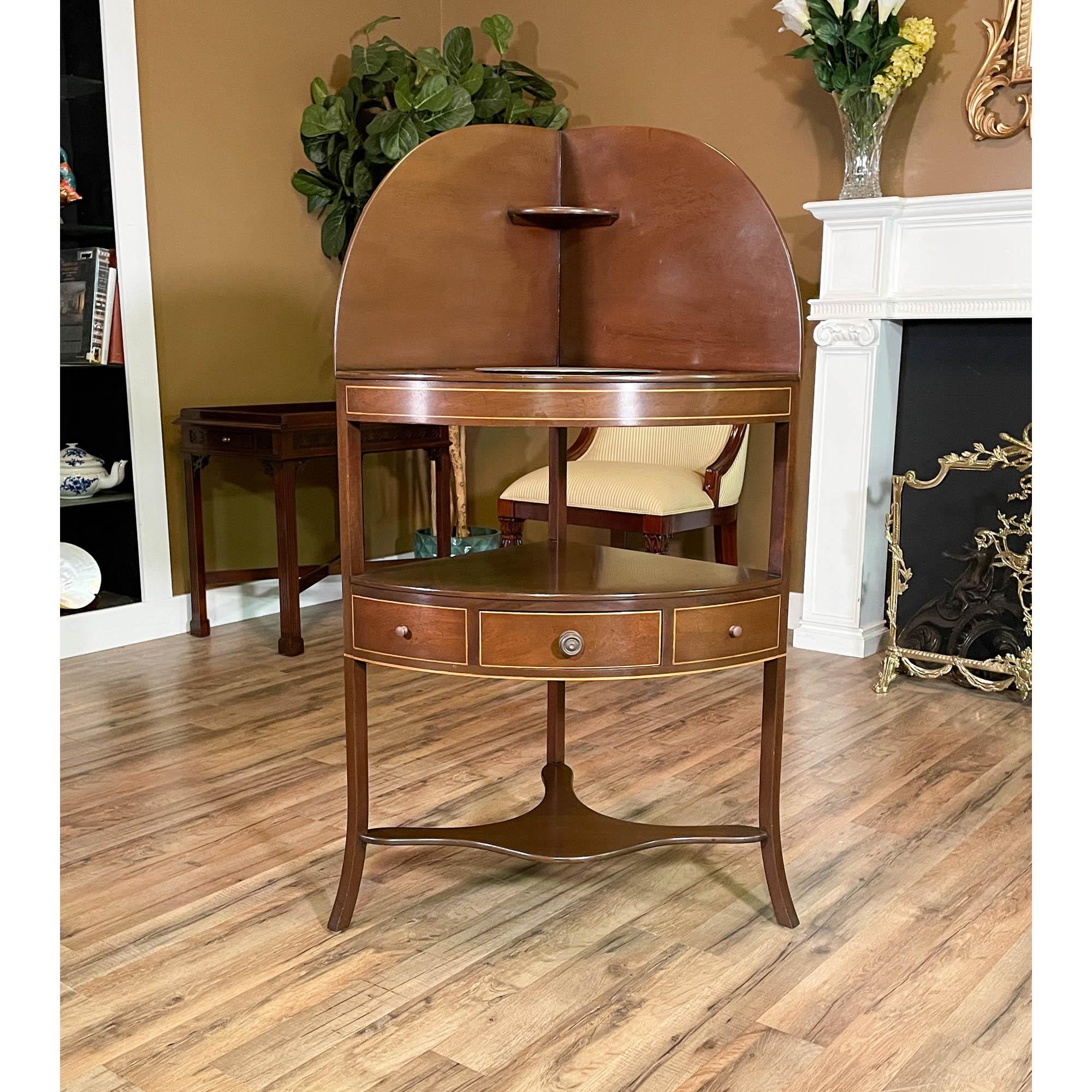 From Niagara Furniture a Vintage Kittinger Corner Mahogany Stand. While petite and elegant this faithful antique reproduction is also sturdy and strong. Great quality construction is the hall mark of the Vintage Kittinger Corner Mahogany Stand and