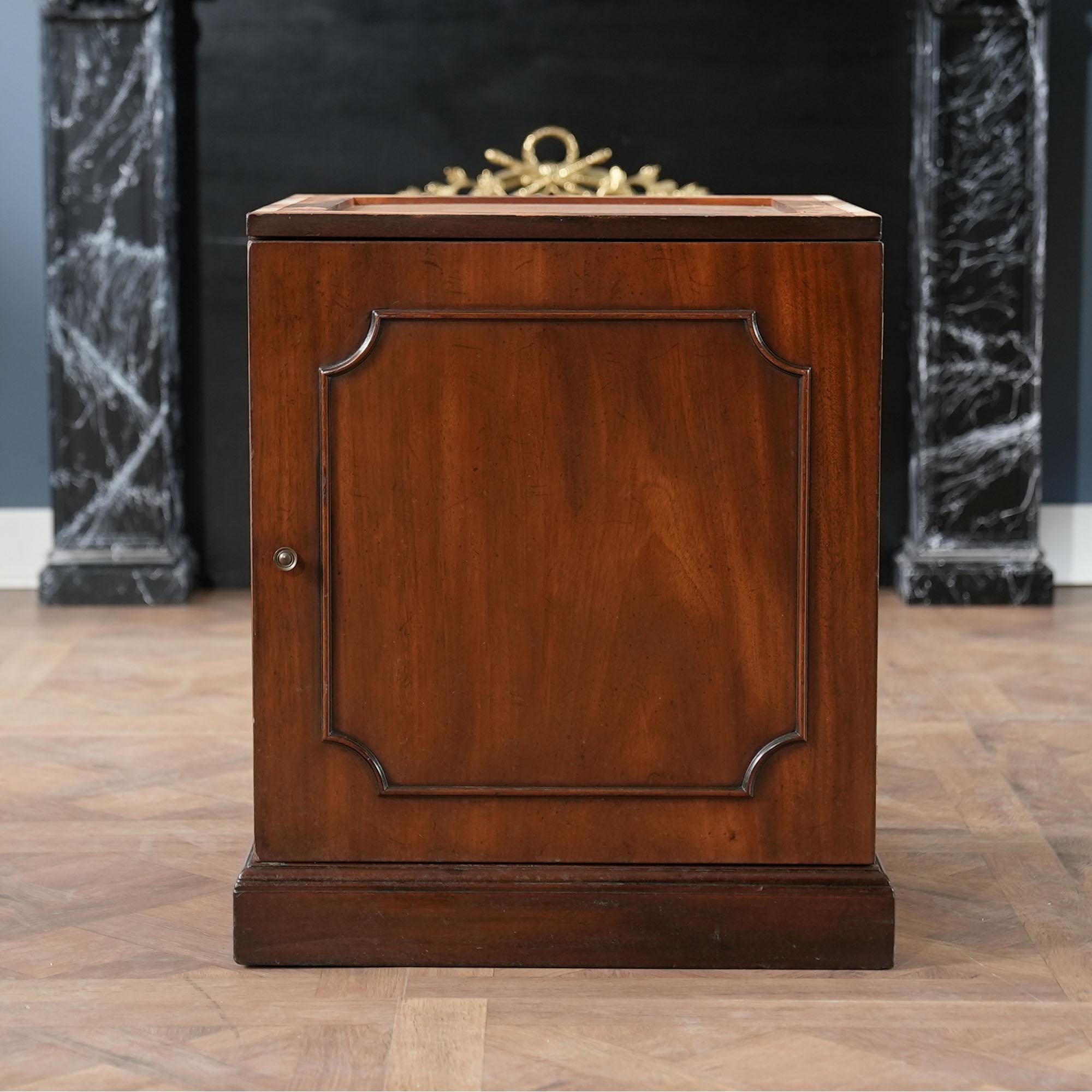 The absolute highest quality piece of American furniture production is exemplified in this Vintage Kittinger Drum Table. From the beautifully decorated and embossed genuine leather top to the sturdy base cupboard everything here works together to