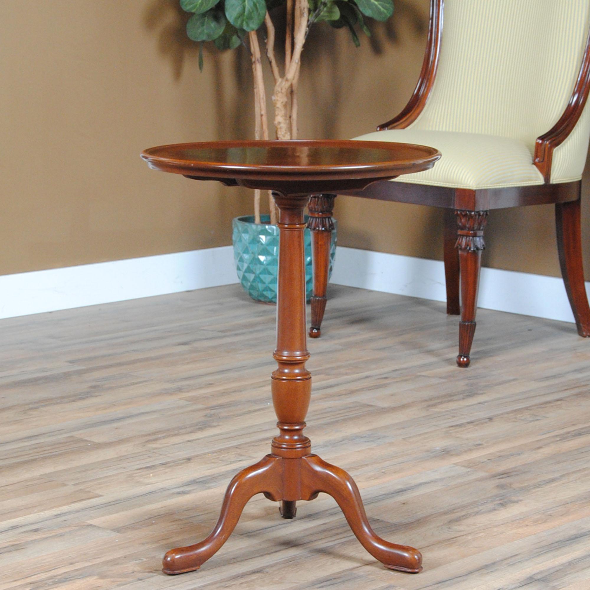 A Vintage Kittinger Table. While petite and elegant this faithful antique reproduction is also sturdy and strong. Great quality construction is the hall mark of the Vintage Kittinger Table and it includes a solId mahogany hand turned column, solid
