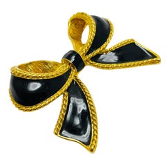 Broche de diseño vintage KJL para AVON firmado en tono dorado con lazo de esmalte