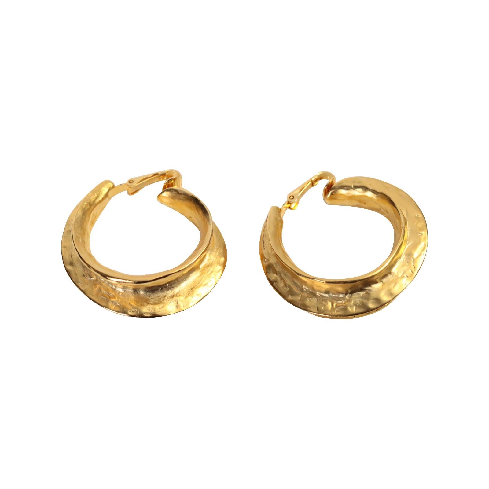 Vintage KJL Gold Tone Wider Hoop Earrings Circa 1990s. These earrings just have a look.  I don't have a lot of the newer KJL items on my curation, but these make the cut.  They appear to have a hammered look and a distinct layer to the hoop, almost