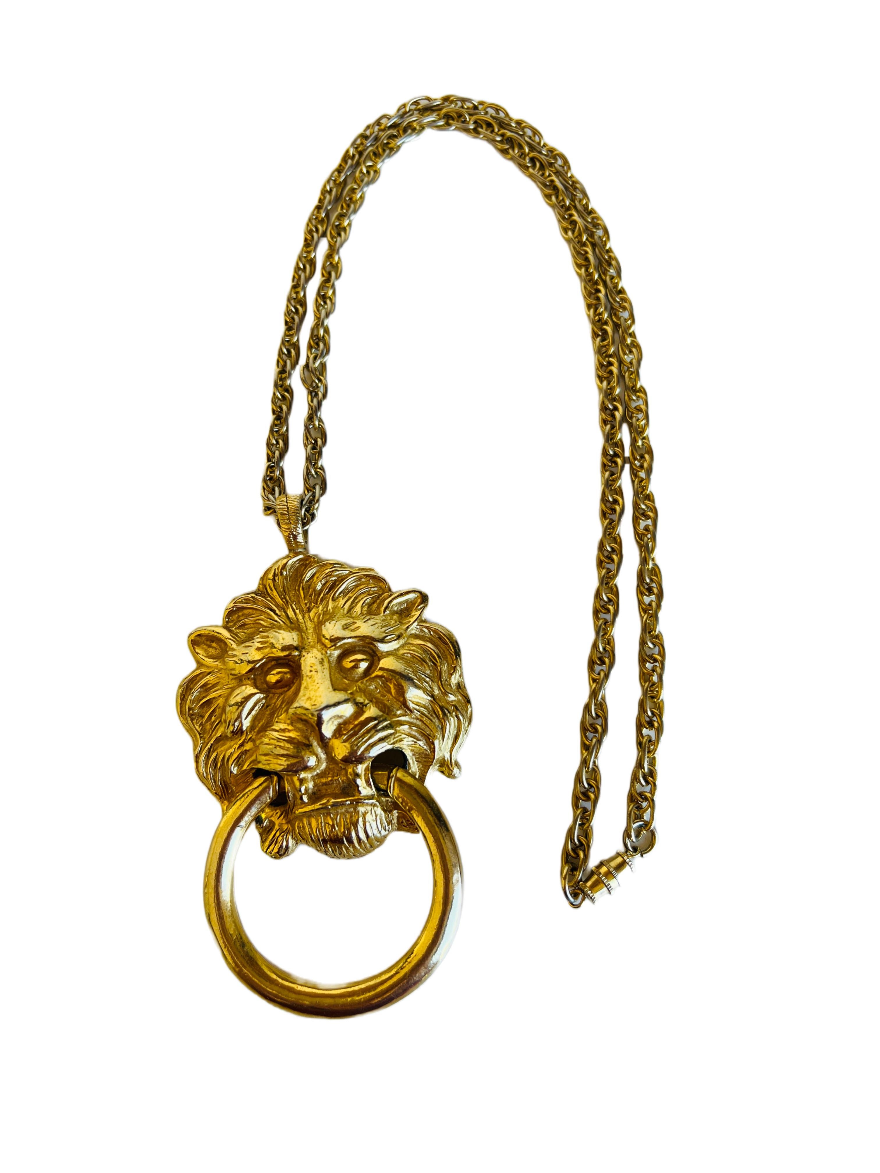 Bold statement necklace featuring a large lion head door knocker pendant by Kenneth Jay Lane. 

Size: The chain is 24-3/4
