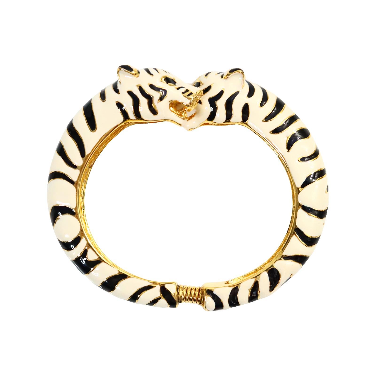Vintage KJL Leopard Black and White Enamel Double Head Clamper Circa 1980s.  This is such a cute statement piece that looks amazing mixed with gold pieces stacked or with other enamel colors of any and all sorts. This bracelet never goes out of
