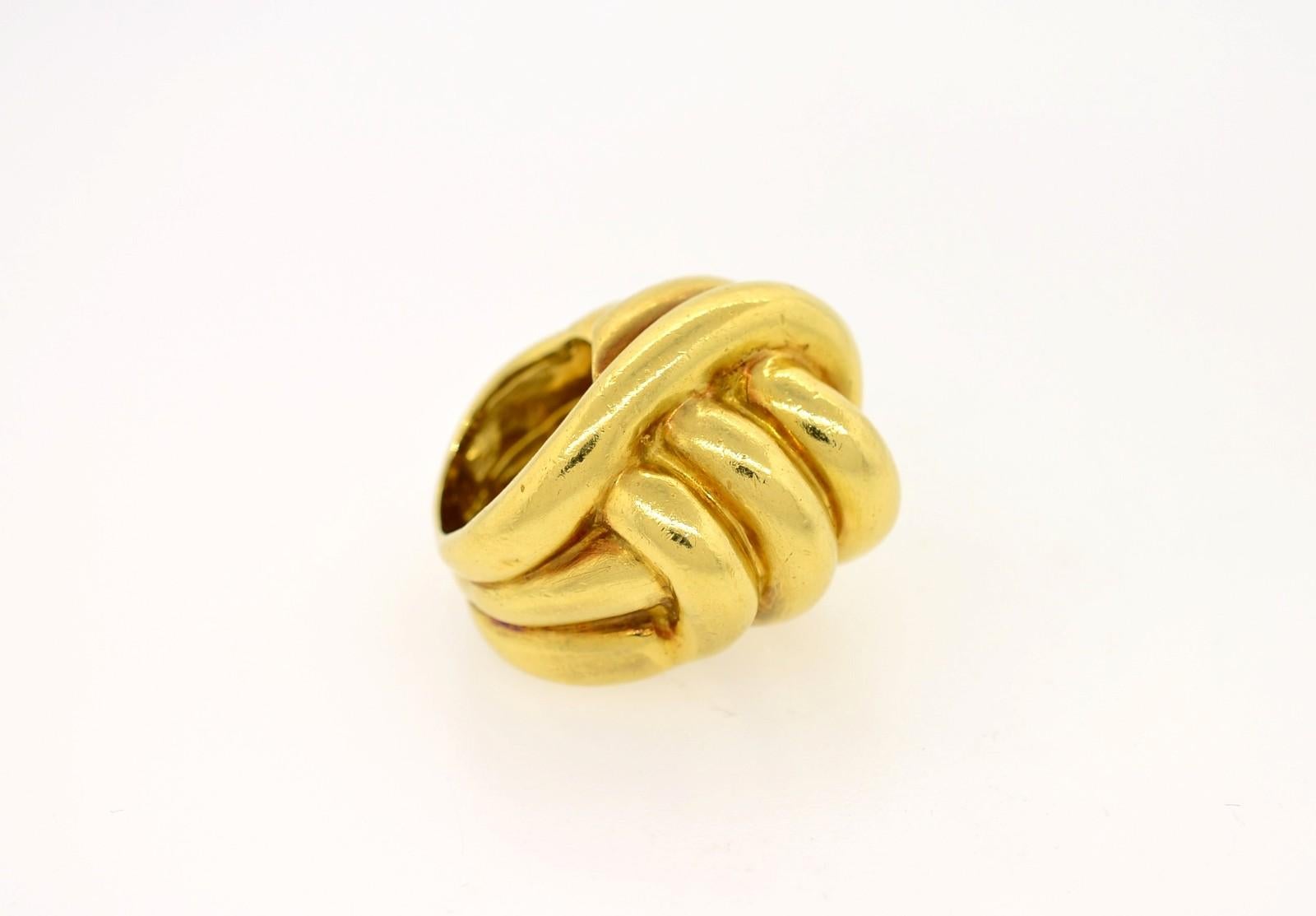 An impressive bold 18KT yellow gold ring of interlocking knot design. The size 6.5 ring is enhanced by its natural patina of fifty years since its creation.  Circa 1970s.   Quite a statement!