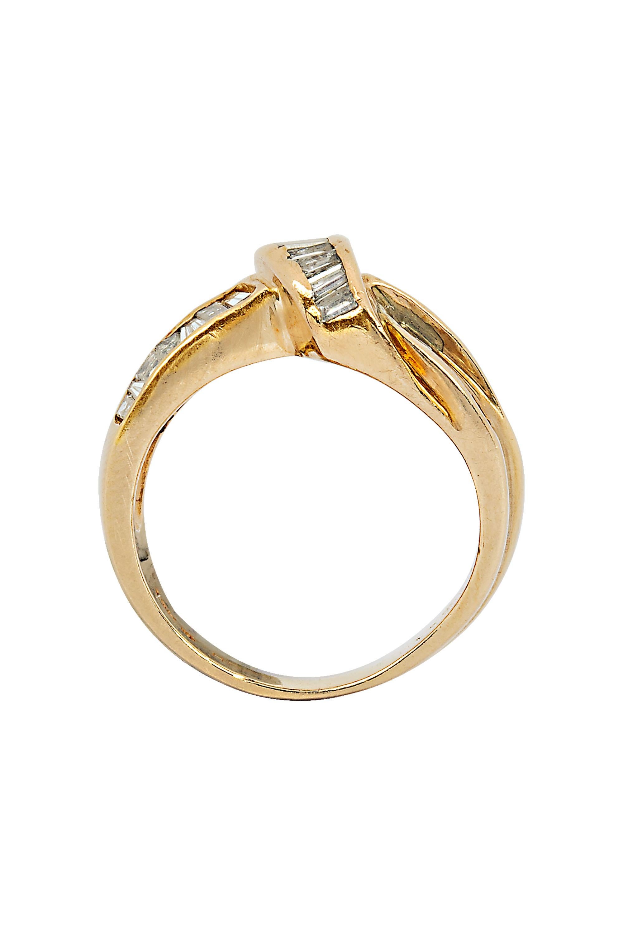 This timeless diamond cocktail wedding ring with knot design containing approximately 1.50 carat baguette near colorless diamond. It is crafted in 14K yellow gold size 6. The ring weighs 6 grams and the top of the ring measures approximately 13 mm.